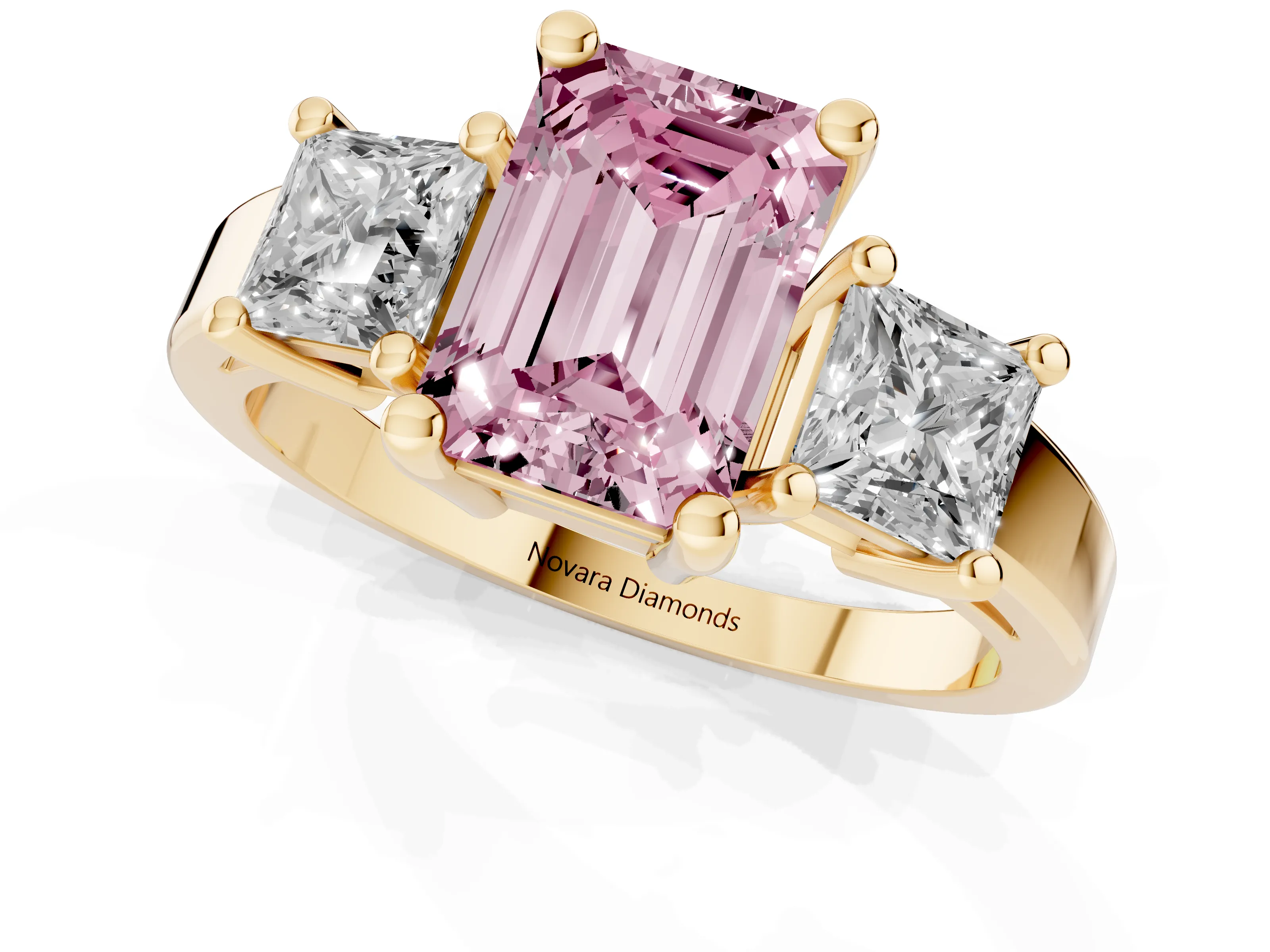 Fancy Pink Three-Stone Emerald Cut Diamond Solitaire Ring Set in Yellow gold with Prong Setting
