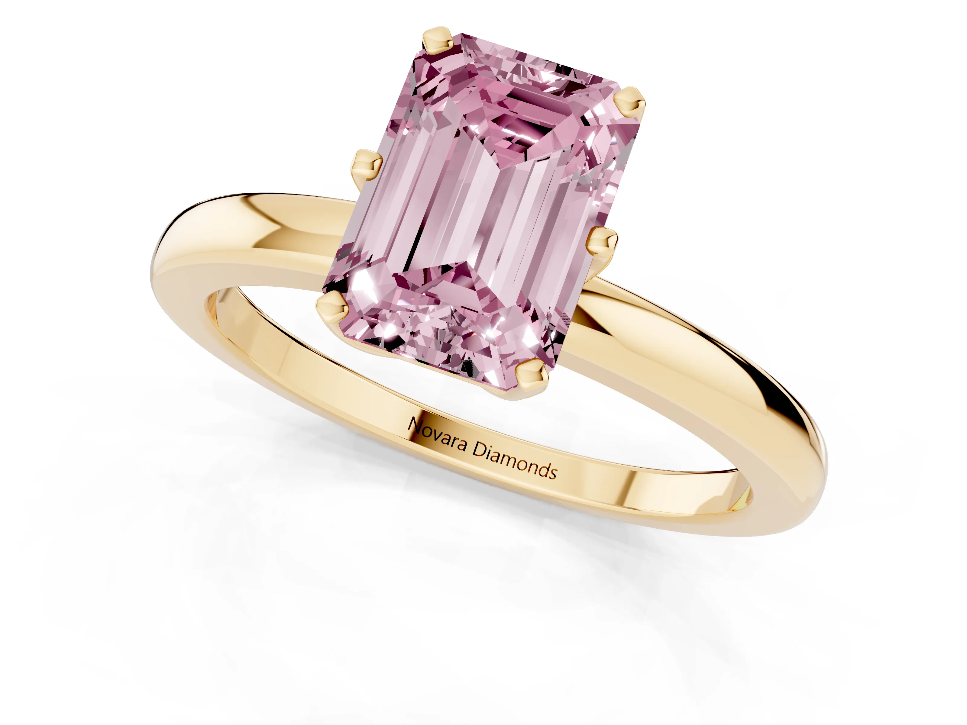 Fancy Pink Emerald Cut Diamond Solitaire Ring Set in Yellow gold with Raised Prong Setting on a Classic Band