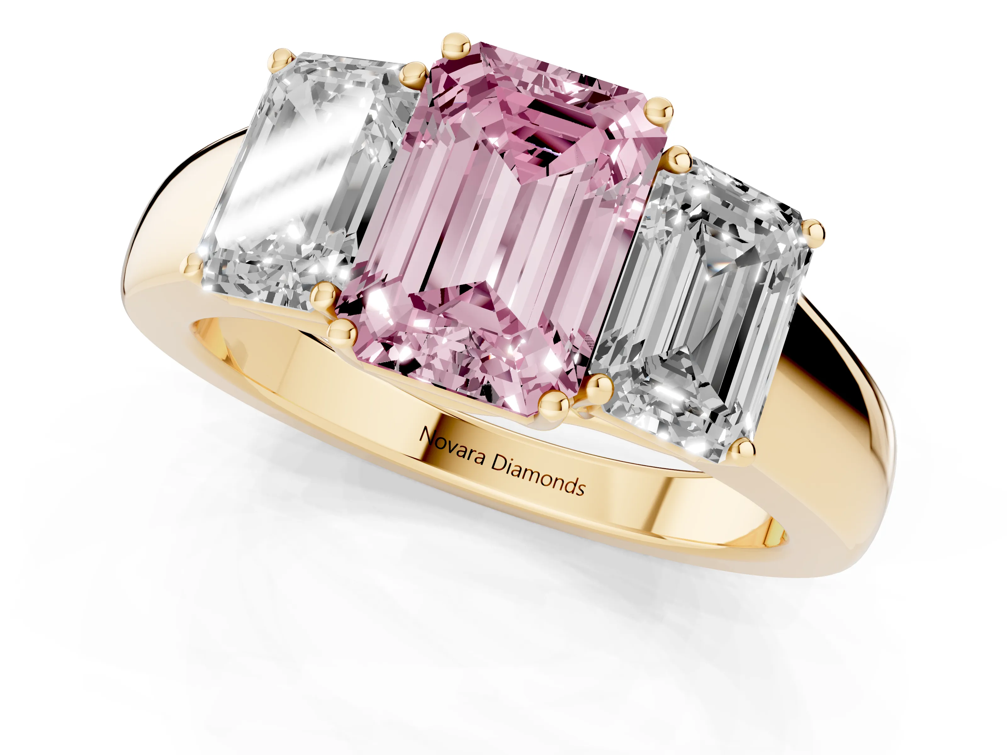 Fancy Pink Three-Stone Emerald Cut Diamond Ring Set in Yellow gold with Matching Prong Settings and Plain Band