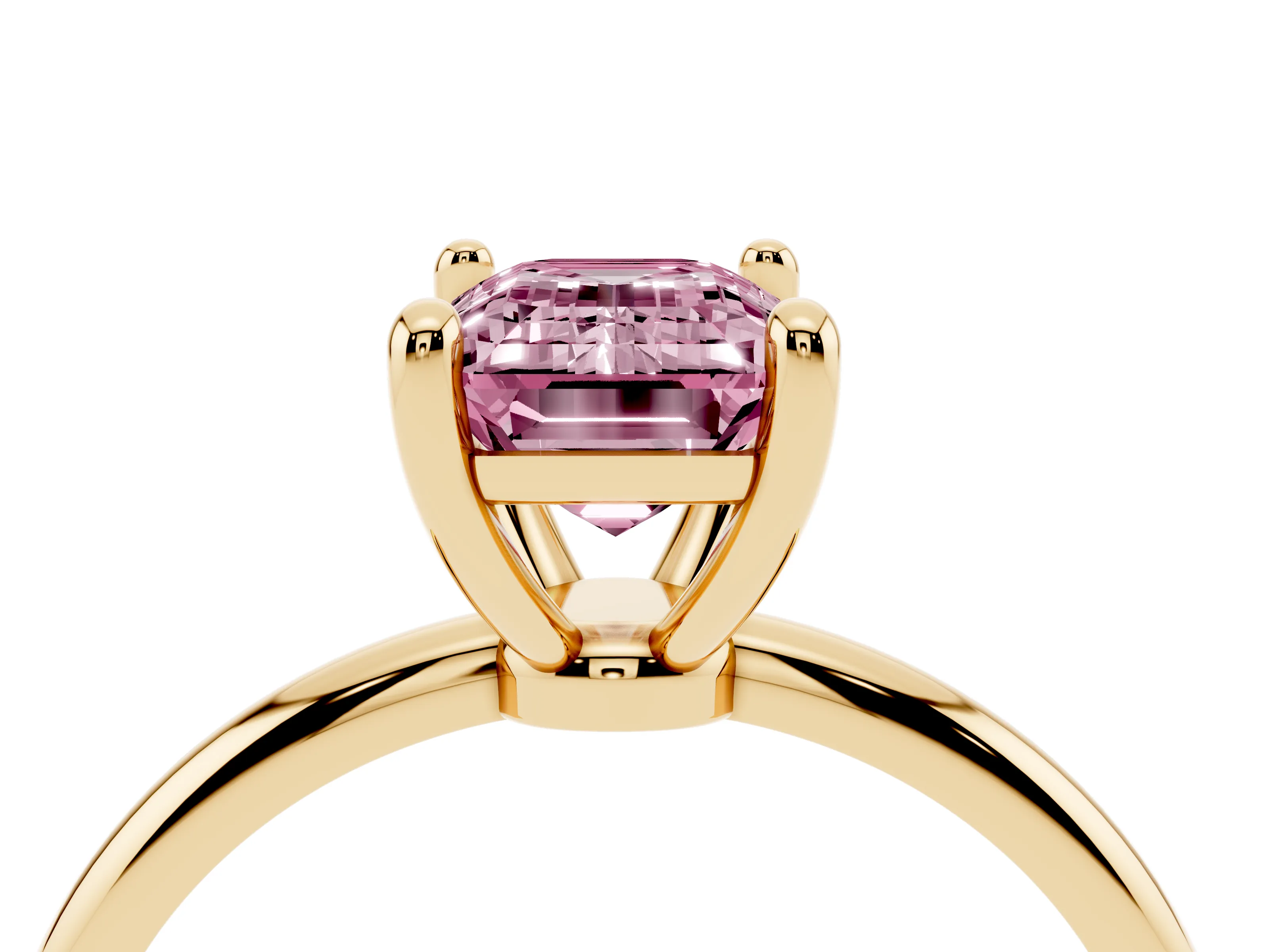 Fancy Pink Emerald Cut Diamond Solitaire Ring Set in Yellow gold with Secure Prong Setting on a Classic Band