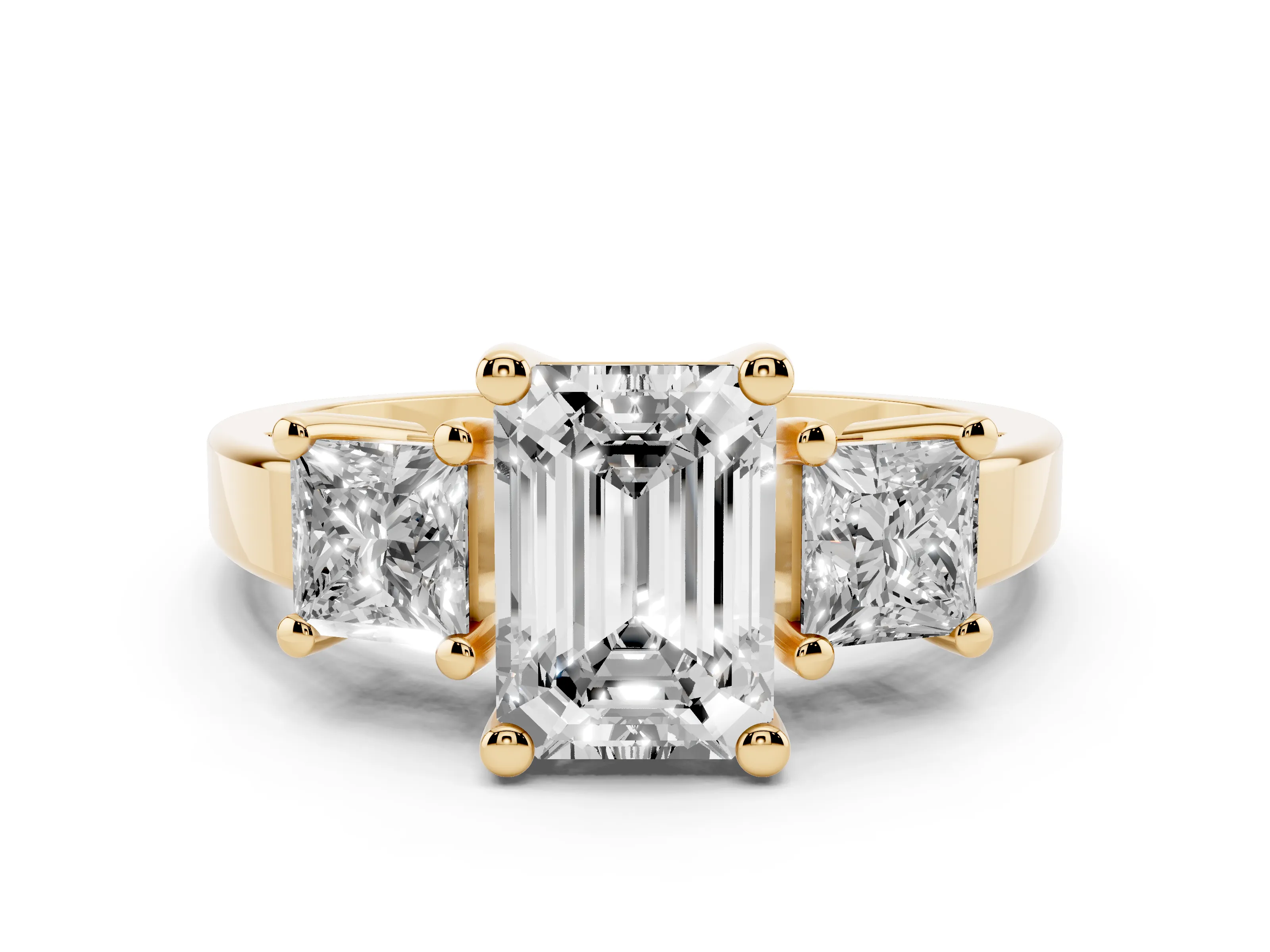 Three-Stone Emerald Cut Diamond Solitaire Ring Set in Yellow gold with Prong Setting