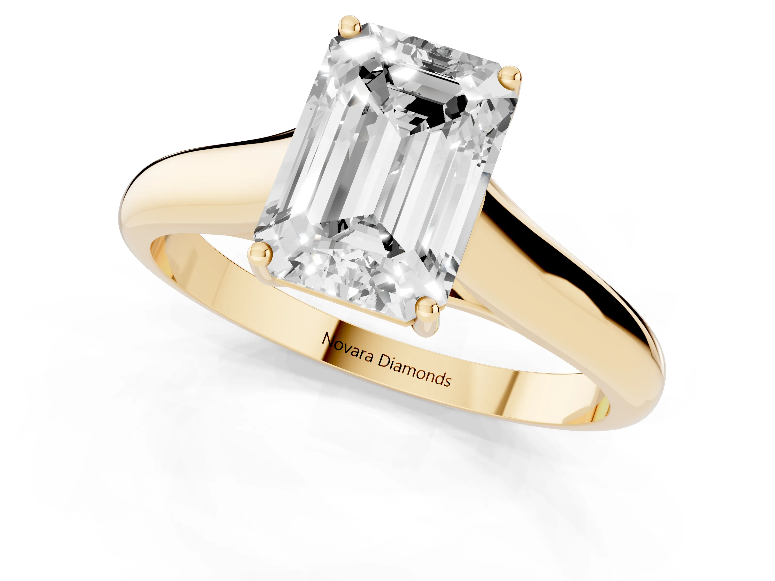 Emerald Cut Diamond Solitaire Engagement Ring Set in Yellow gold with Subtly Tapered Band and Prong Setting
