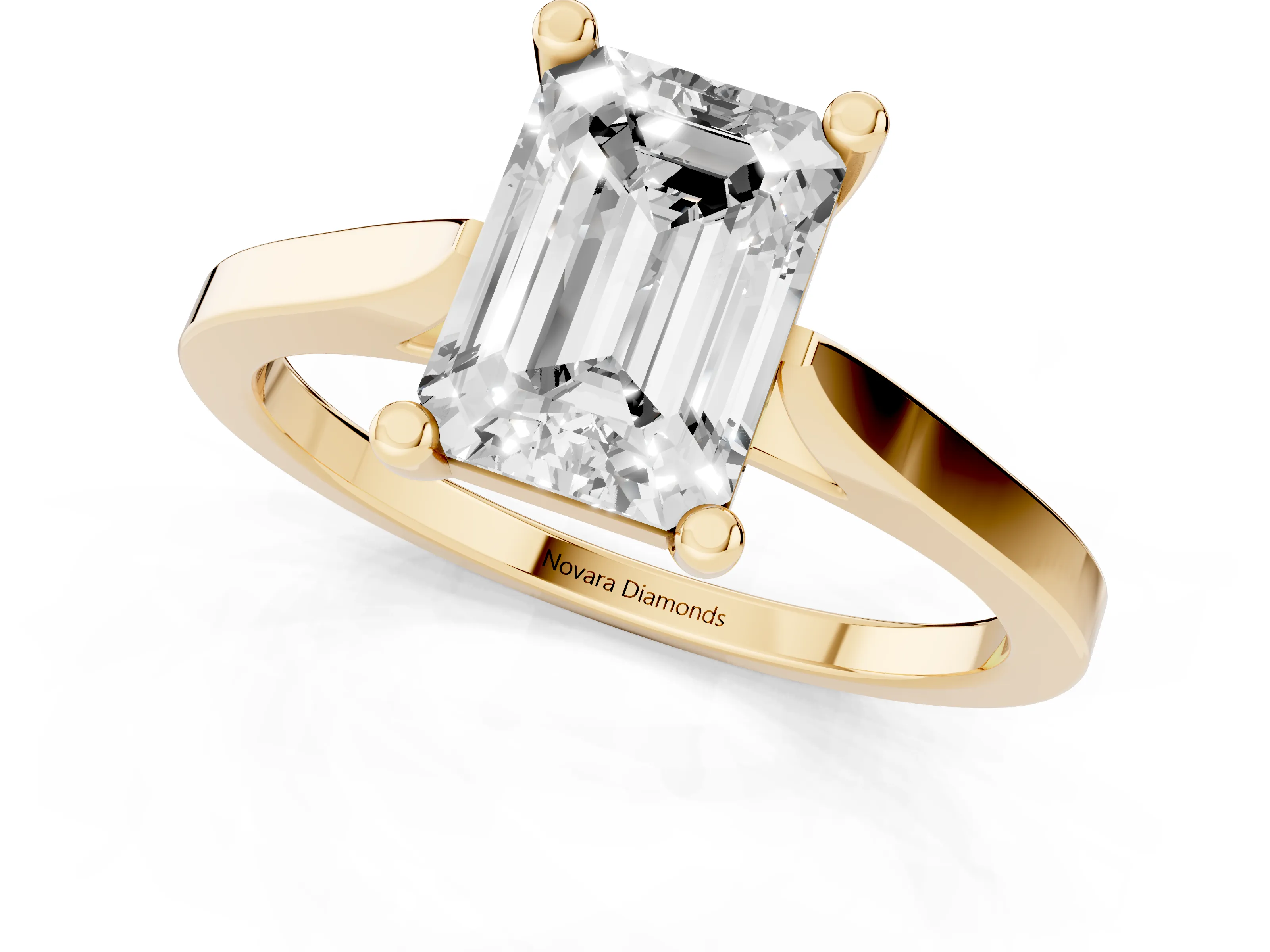 Emerald Cut Diamond Solitaire Ring Set in Yellow gold with Prong Setting and Tapered Band