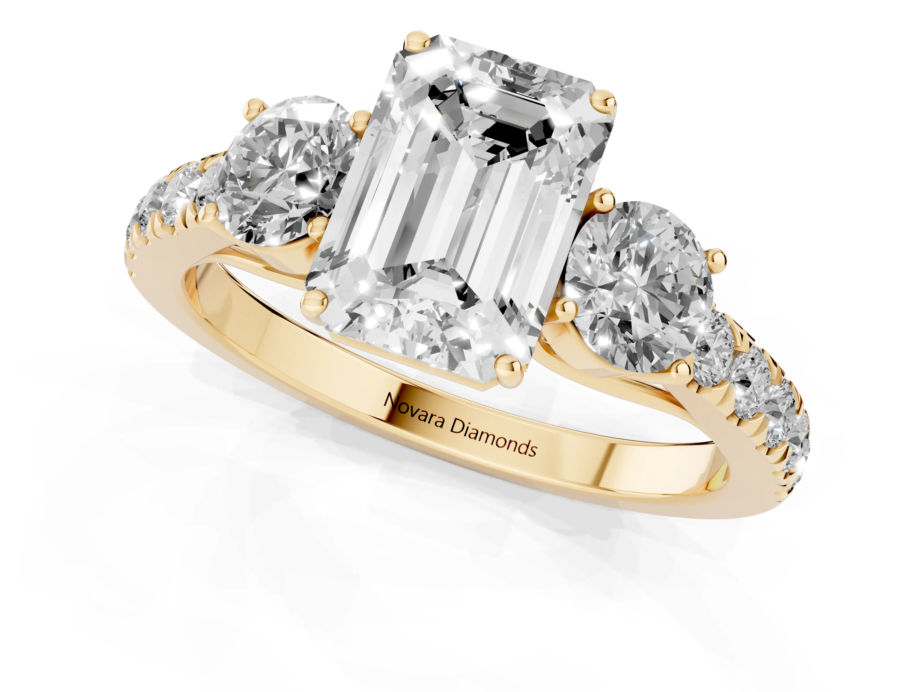 Emerald Cut Diamond Three-Stone Ring Set in Yellow gold with Round Side Stones and Delicate Pavé Band