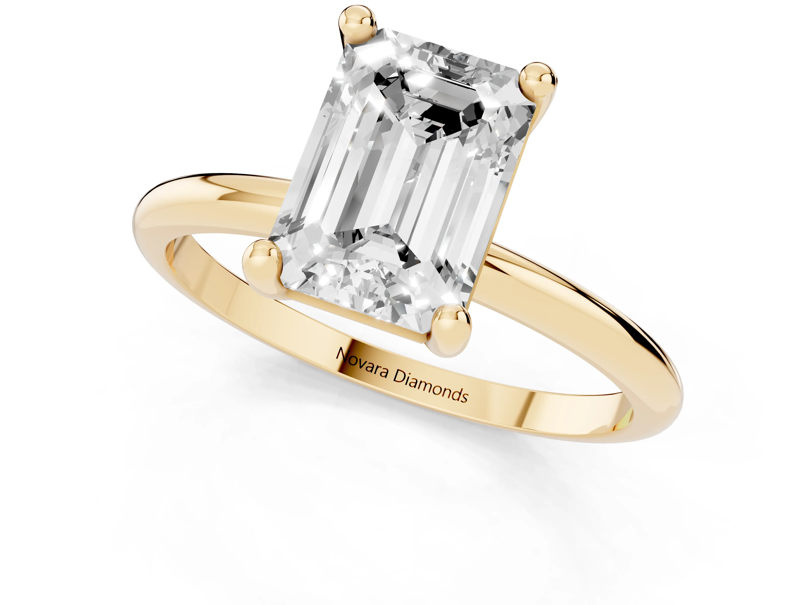 Emerald Cut Diamond Solitaire Ring Set in Yellow gold with Secure Prong Setting on a Classic Band