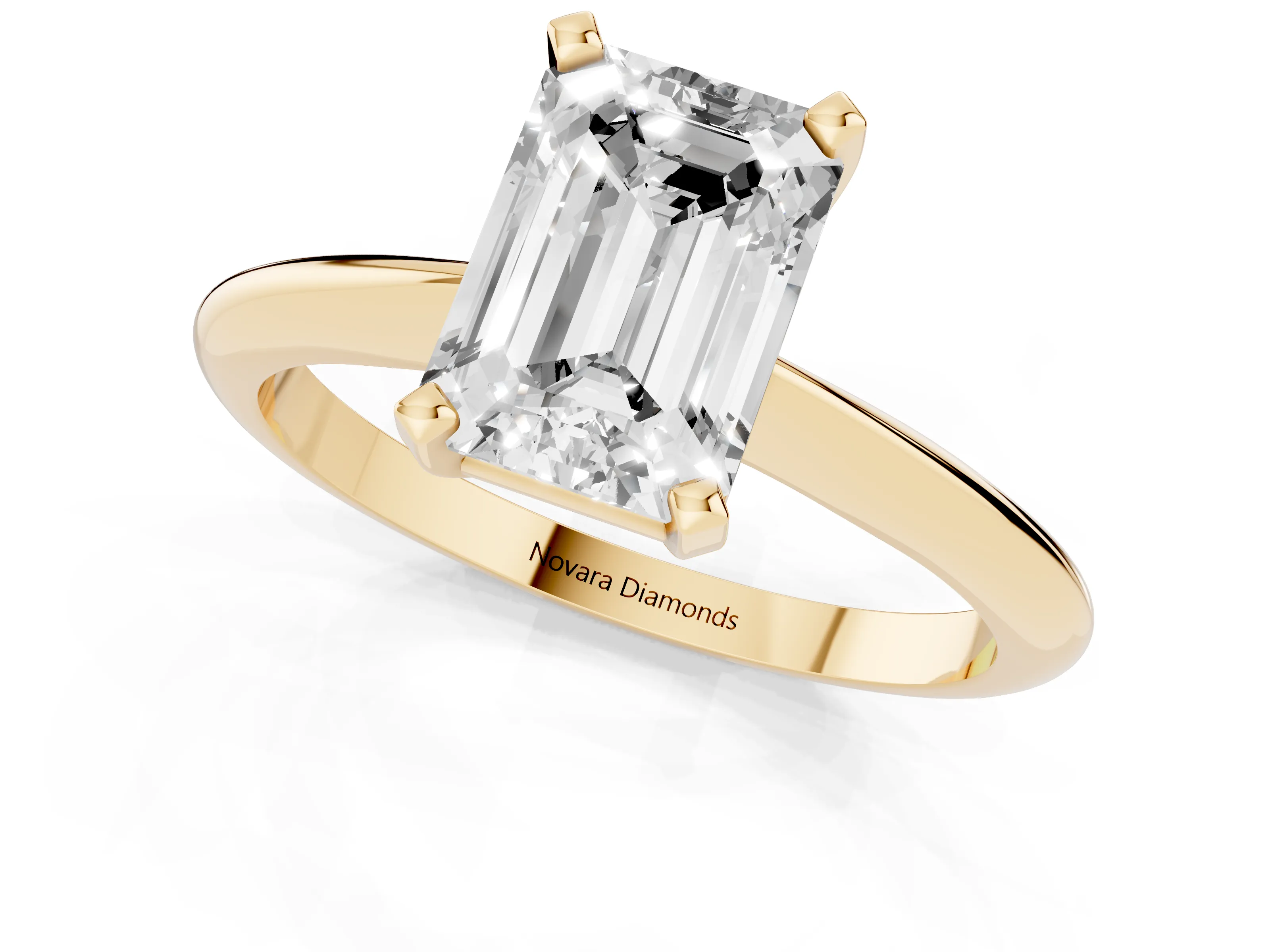 Emerald Cut Diamond Solitaire Ring Set in Yellow gold with Prong Setting on a Plain Round Band