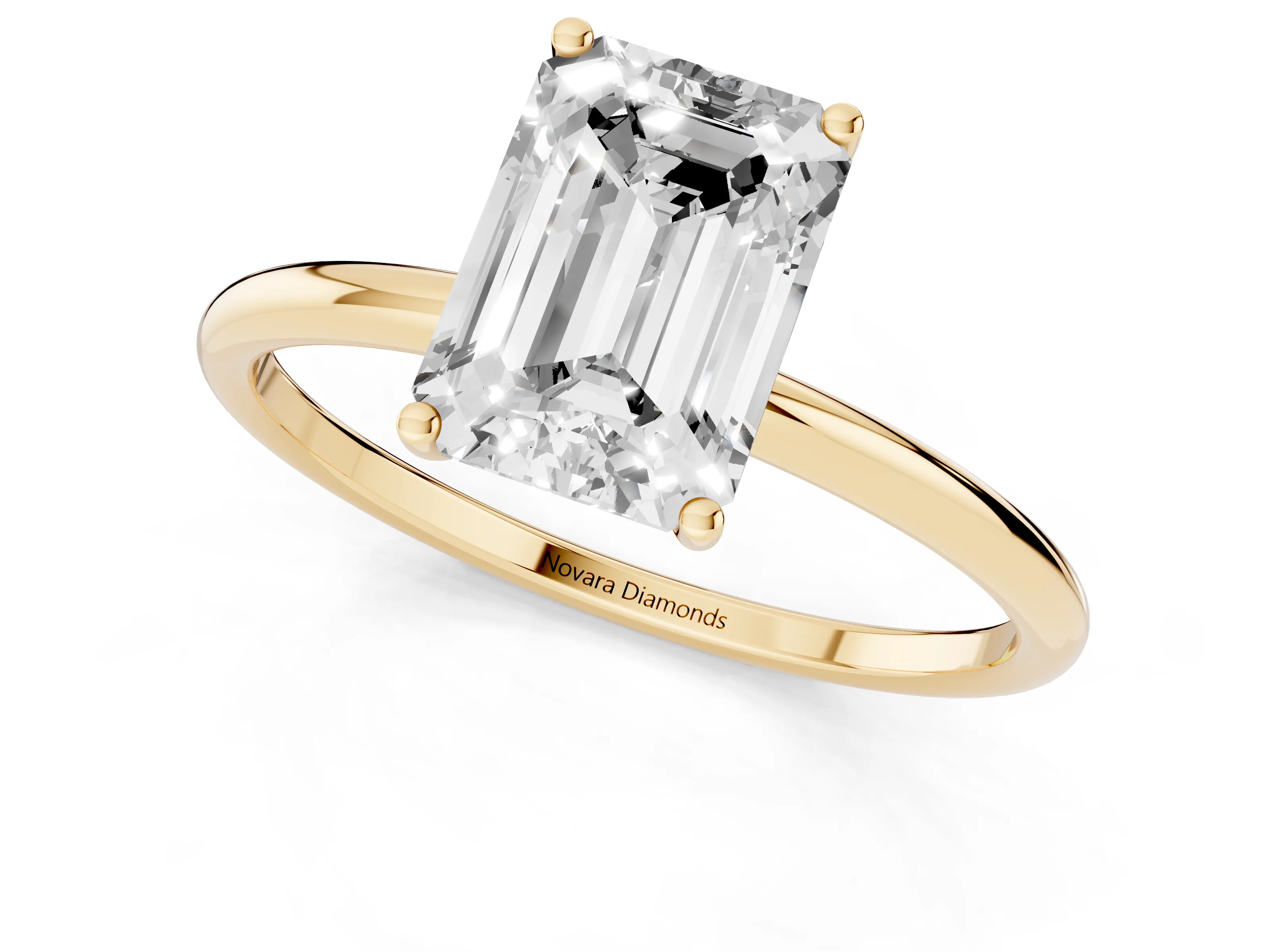 Emerald Cut Diamond Solitaire Engagement Ring Set in Yellow gold with Thin Band and Prong Setting