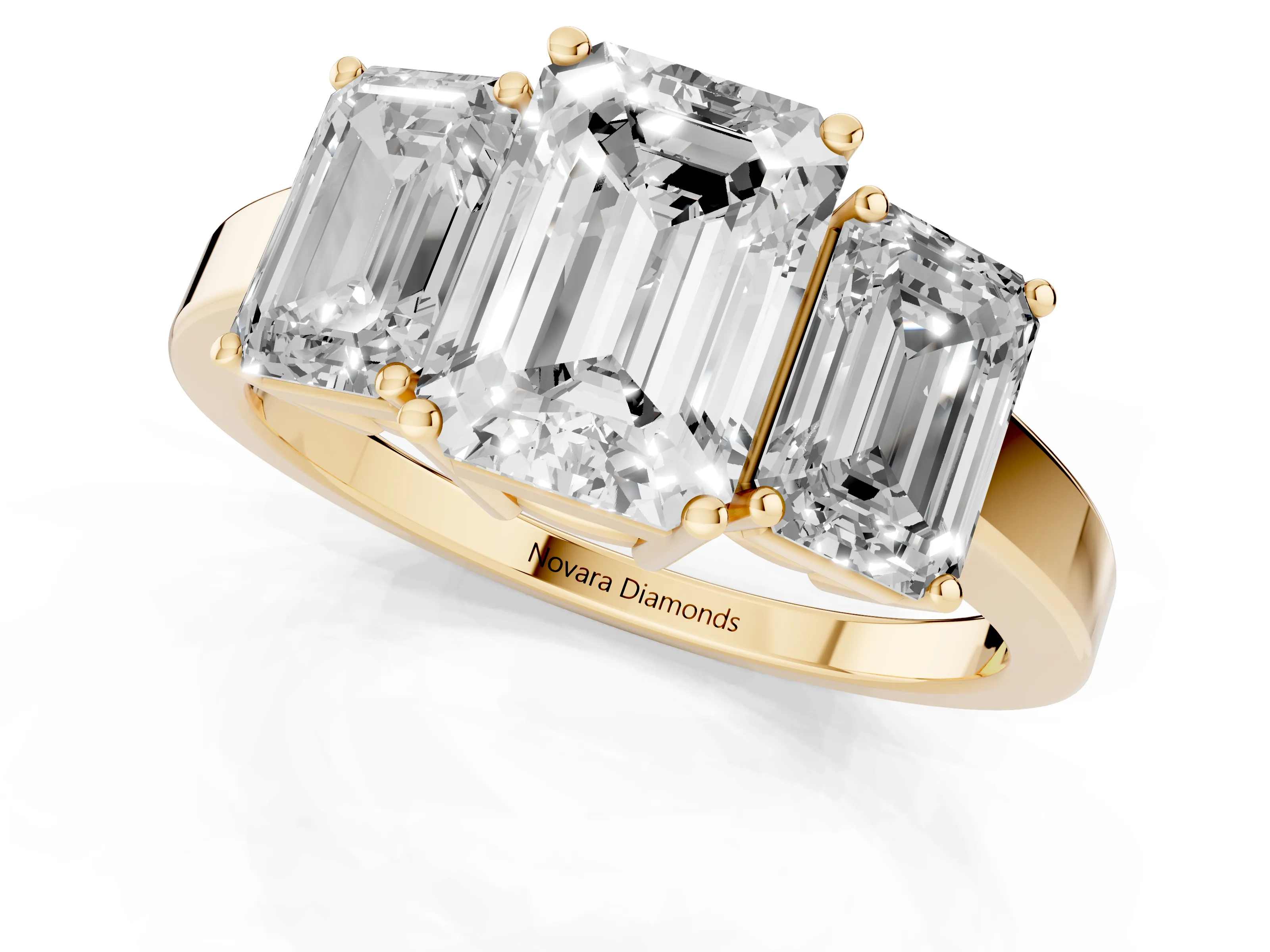 Emerald Cut Diamond Three-Stone Engagement Ring Set in Yellow gold with Flat Band
