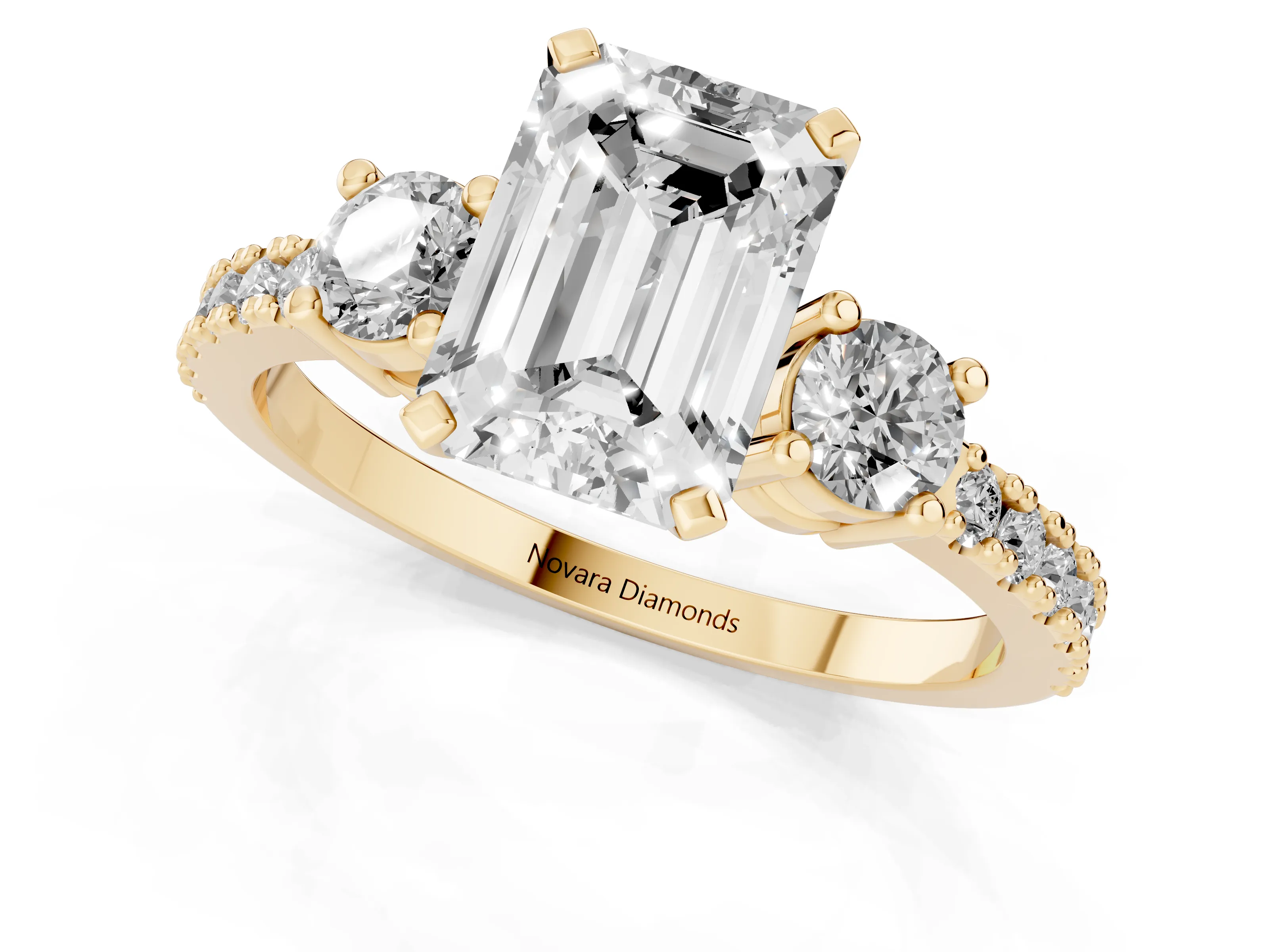 Three-Stone Emerald Cut Diamond Pavé Band Ring Set in Yellow gold with Prong Setting