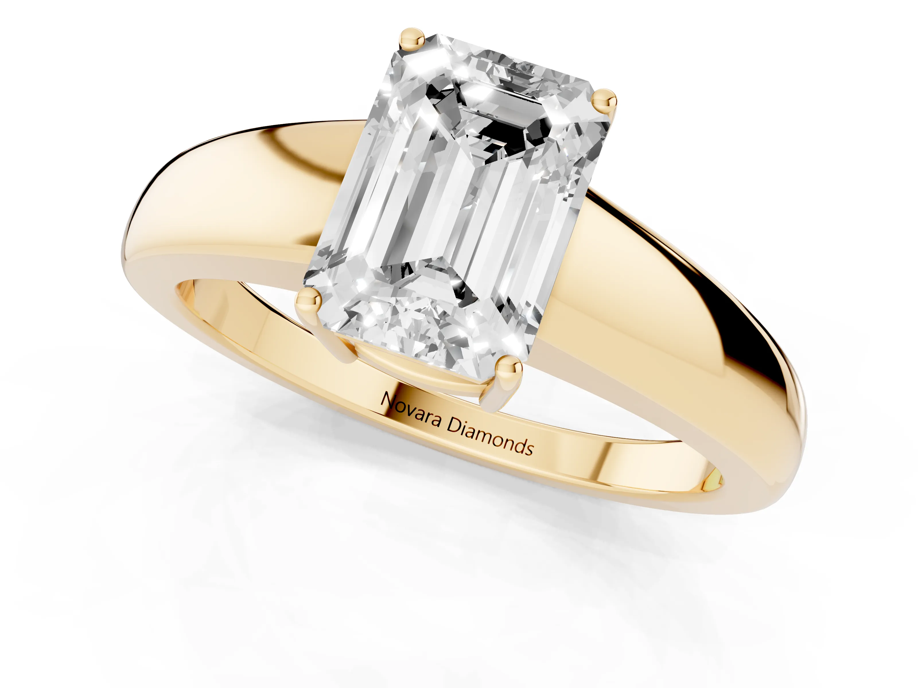 Emerald Cut Diamond Solitaire Ring Set in Yellow gold with Tapered Band and Prong Setting