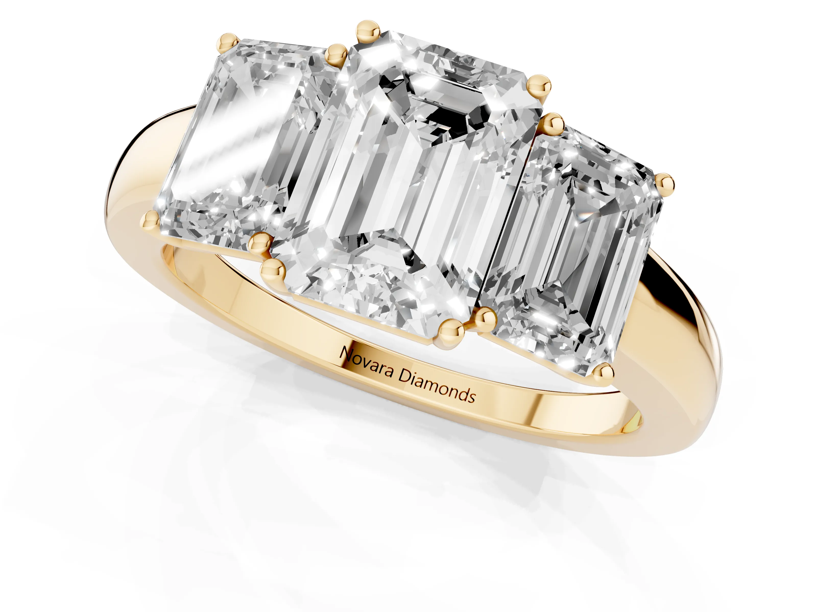 Emerald Cut Diamond Three-Stone Ring Set in Yellow gold with Bold Center and Classic Band