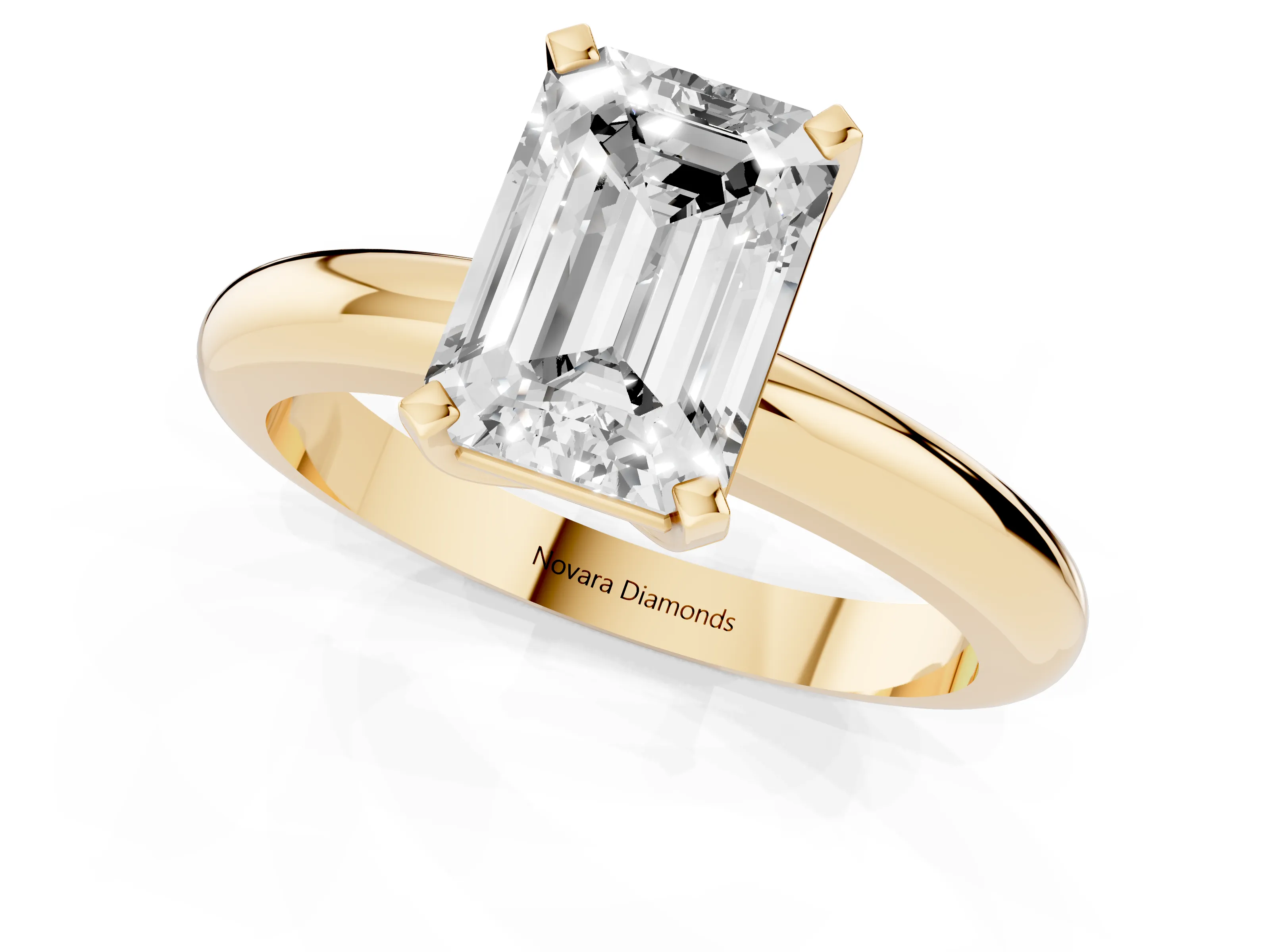 Emerald Cut Diamond Solitaire Engagement Ring Set in Yellow gold with Round Band and Prong Setting