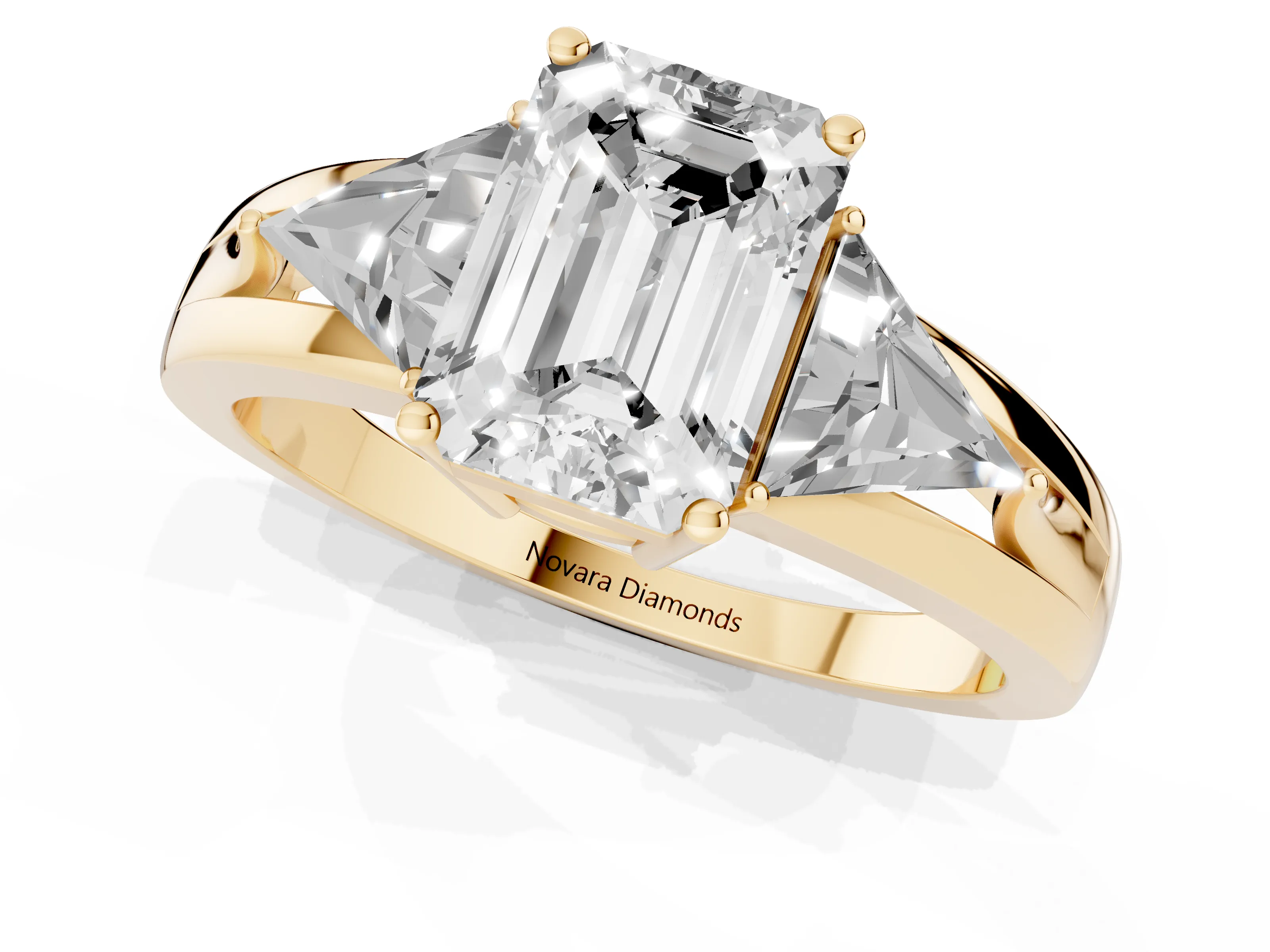 Emerald Cut Diamond Three-Stone Ring Set in Yellow gold with Trillion Side Stones and Split Shank