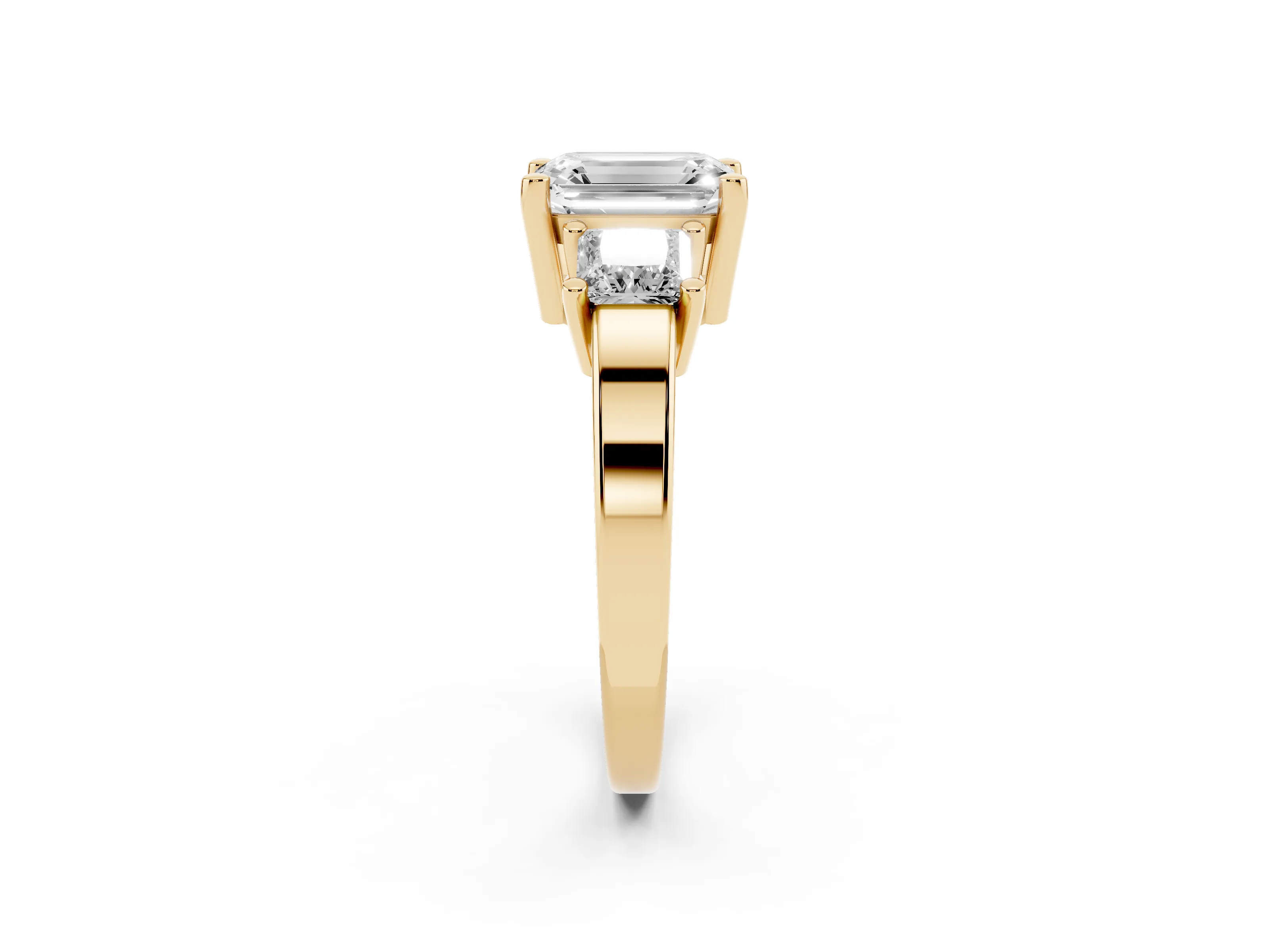Three-Stone Emerald Cut Diamond Solitaire Ring Set in Yellow gold with Prong Setting