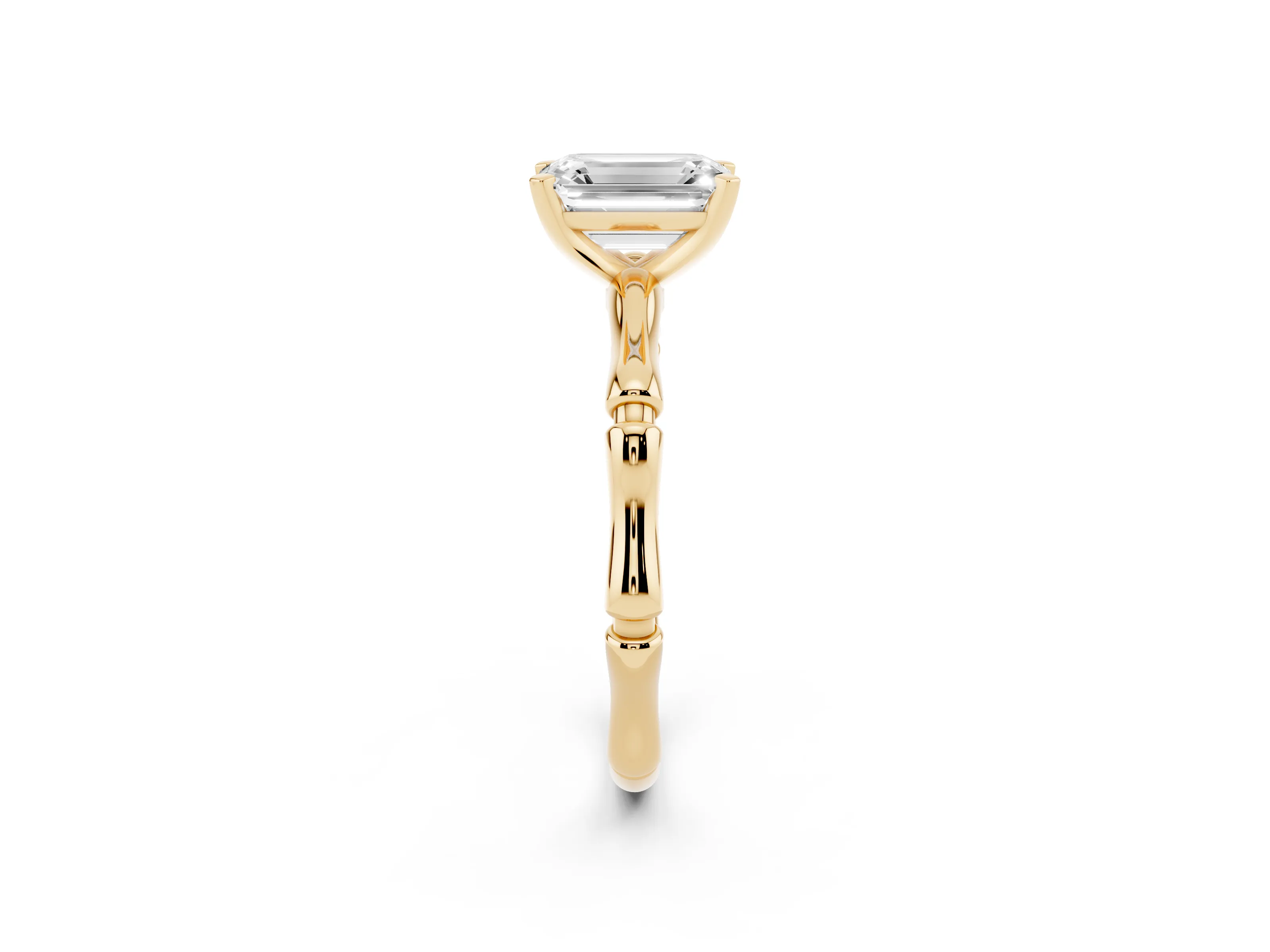 Emerald Cut Diamond Solitaire Ring Set in Yellow gold with Bamboo Band and Prong Setting
