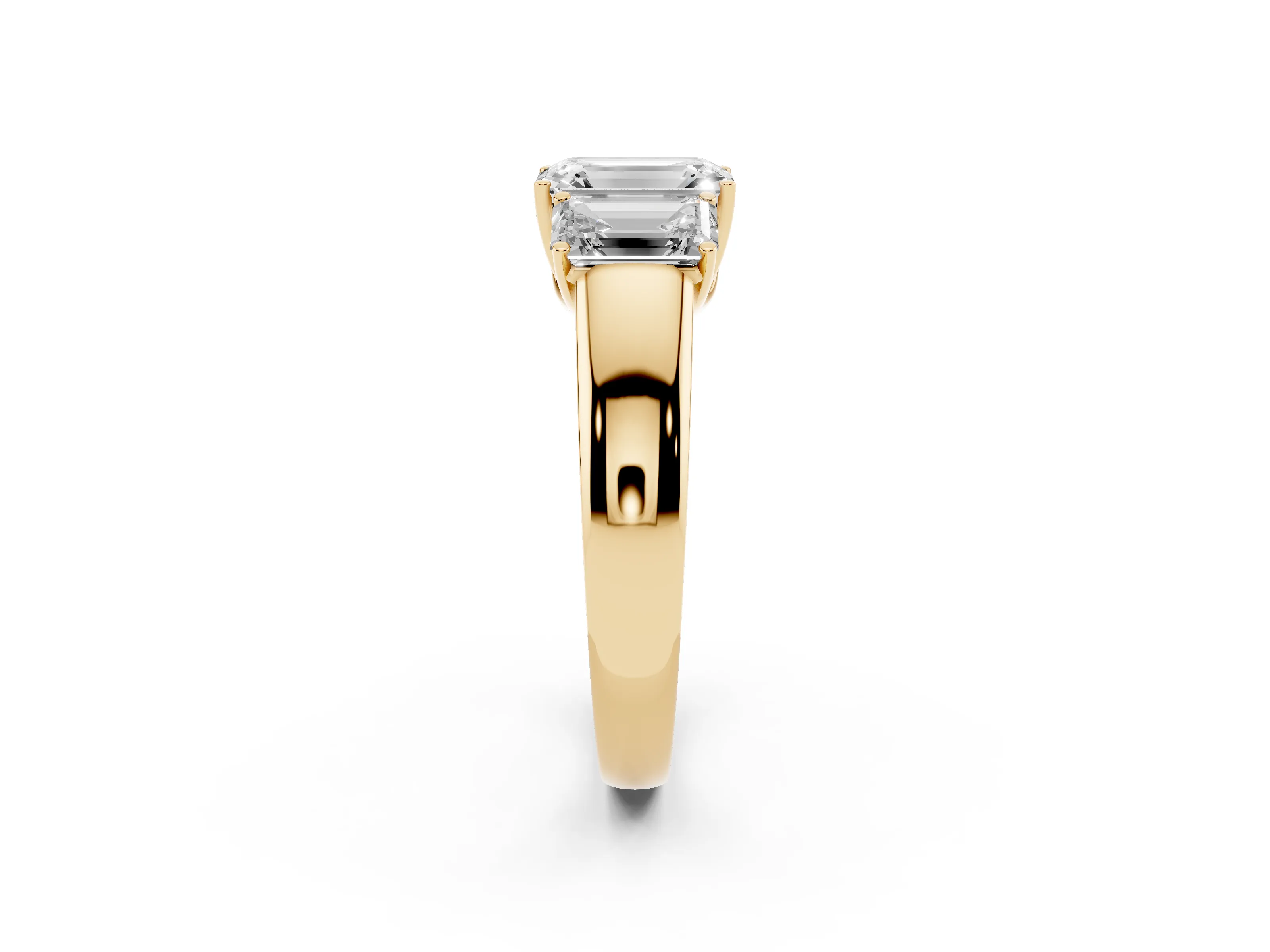 Three-Stone Emerald Cut Diamond Ring Set in Yellow gold with Matching Prong Settings and Plain Band
