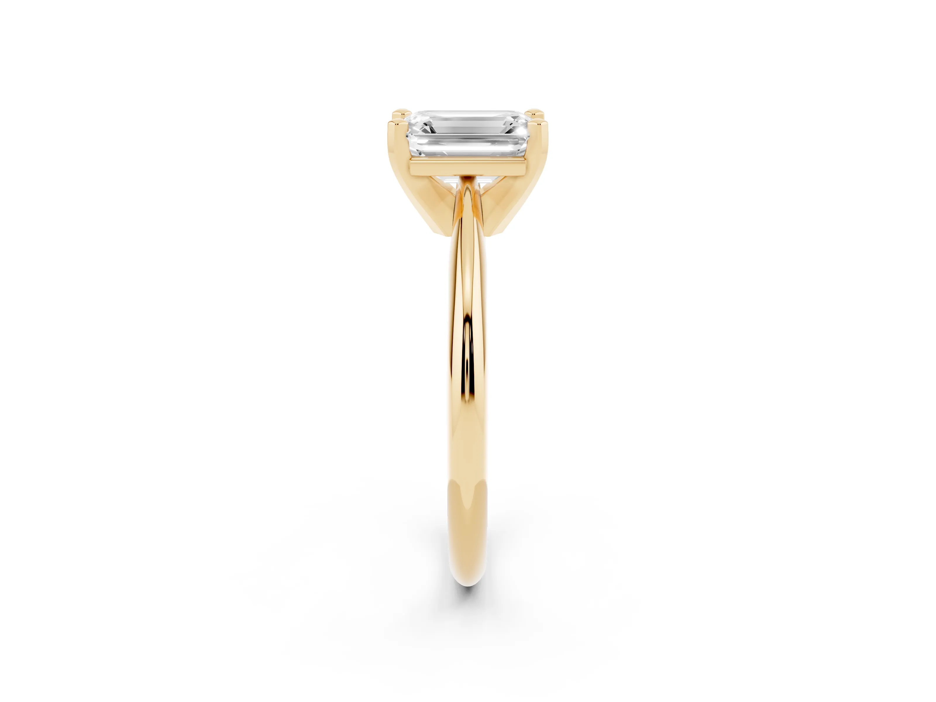 Emerald Cut Diamond Solitaire Ring Set in Yellow gold with Prong Setting on a Plain Round Band