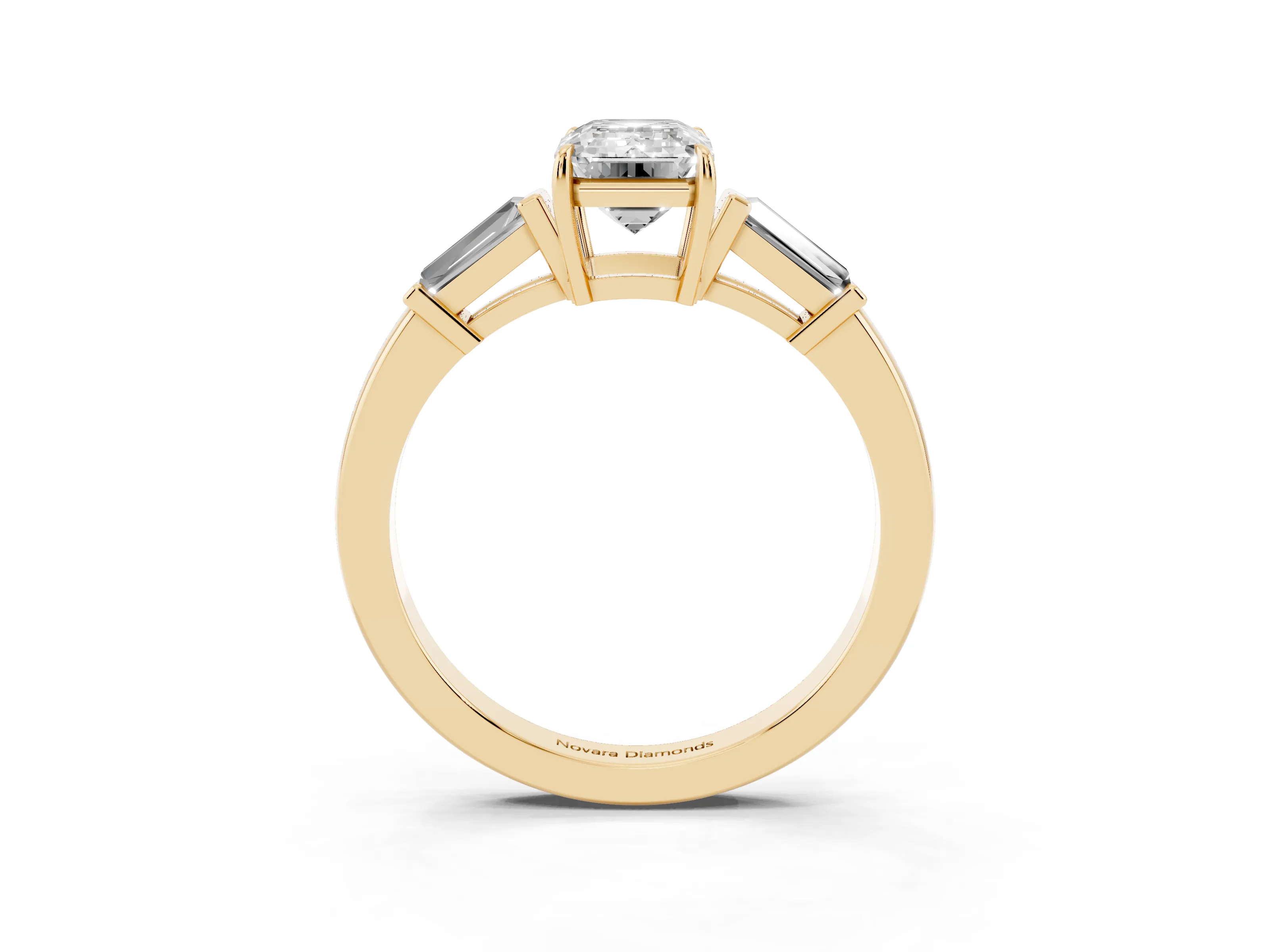 Emerald Cut Diamond Three-Stone Ring Set in Yellow gold with Tapered Baguette Side Stones and Prong Setting
