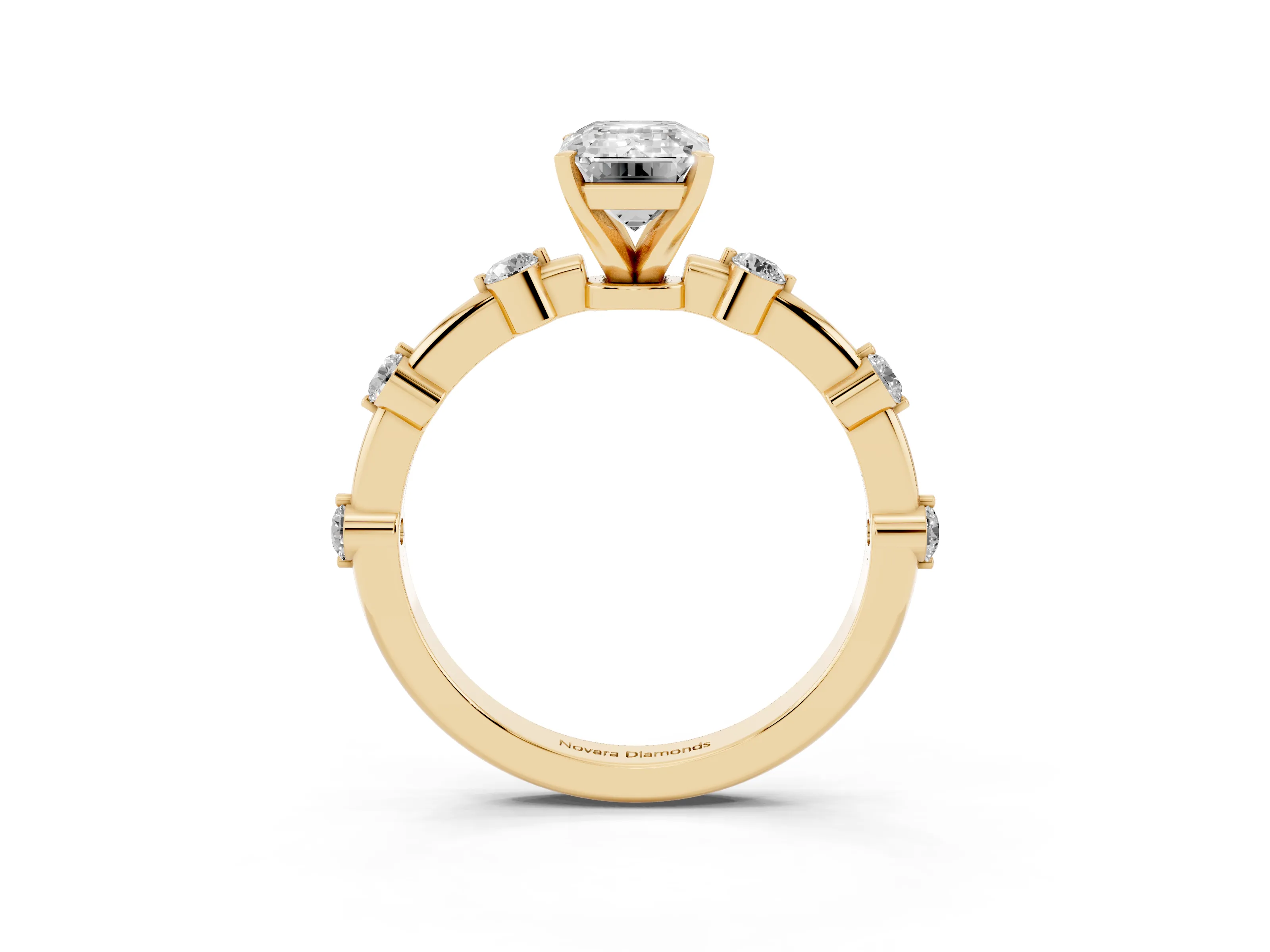 Emerald Cut Diamond Solitaire Ring Set in Yellow gold with Bezel Set Side Stones and Prong Setting