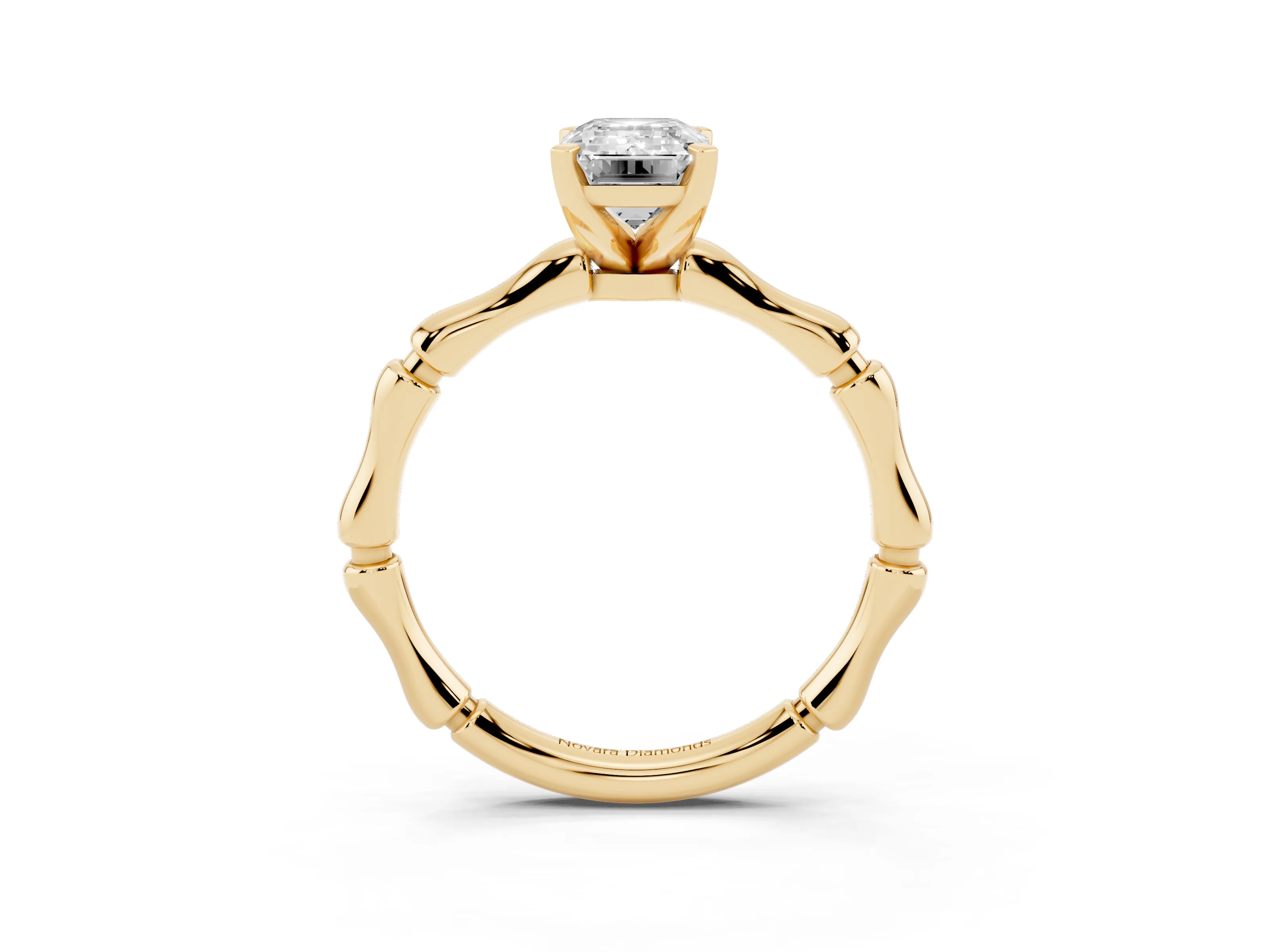 Emerald Cut Diamond Solitaire Ring Set in Yellow gold with Bamboo Band and Prong Setting