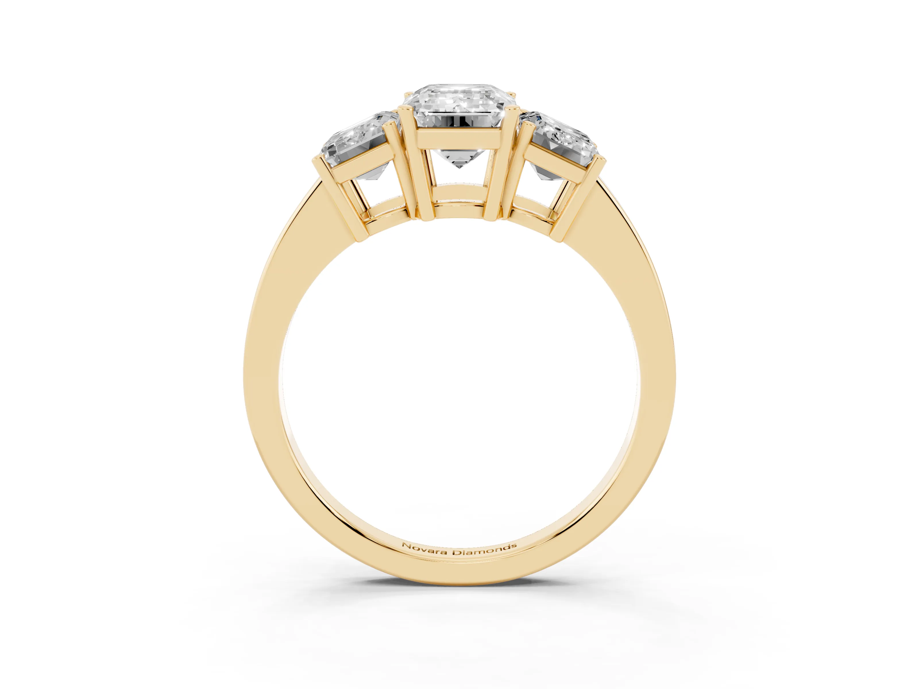 Emerald Cut Diamond Three-Stone Engagement Ring Set in Yellow gold with Flat Band