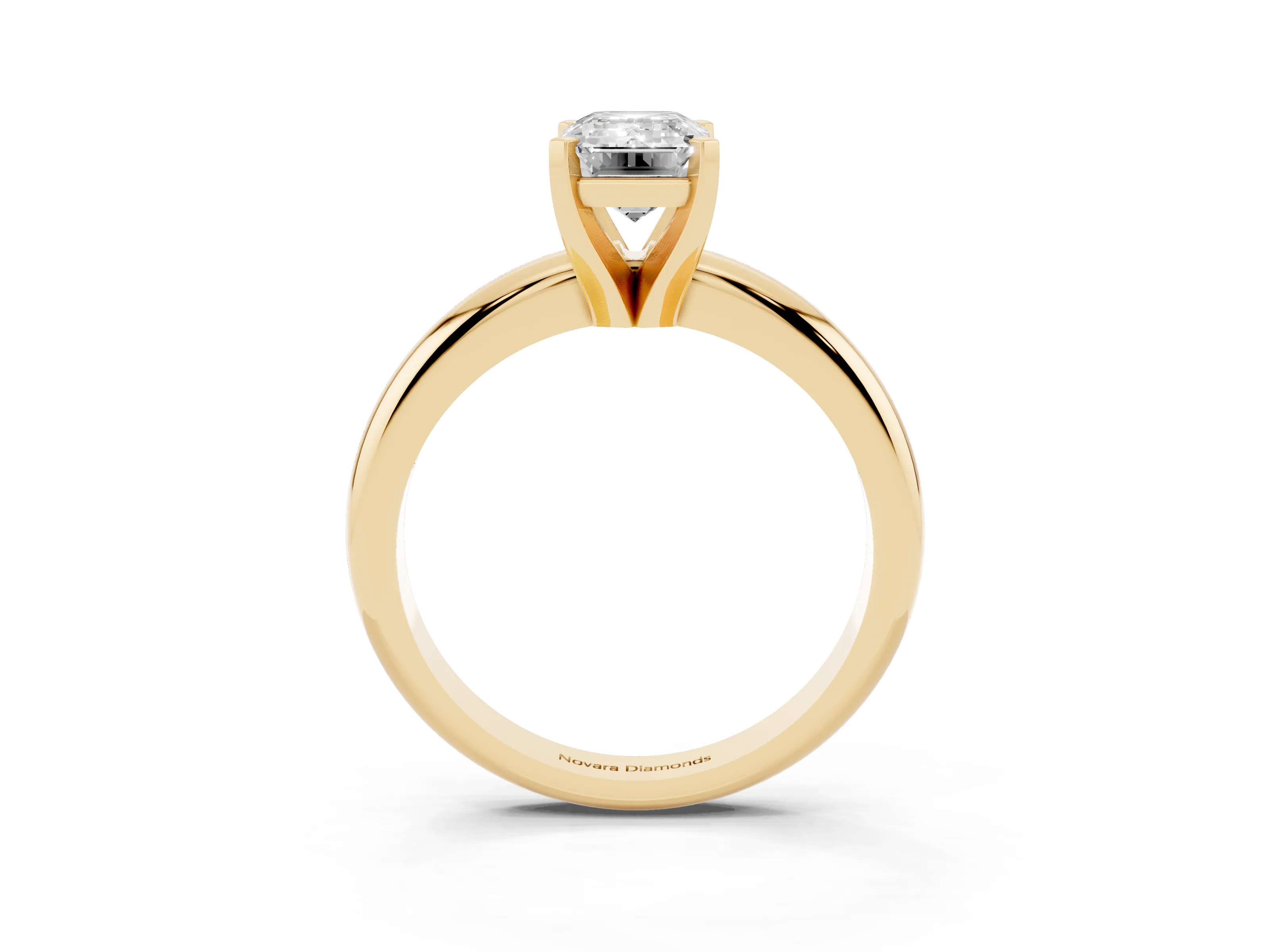 Emerald Cut Diamond Solitaire Engagement Ring Set in Yellow gold with Round Band and Prong Setting