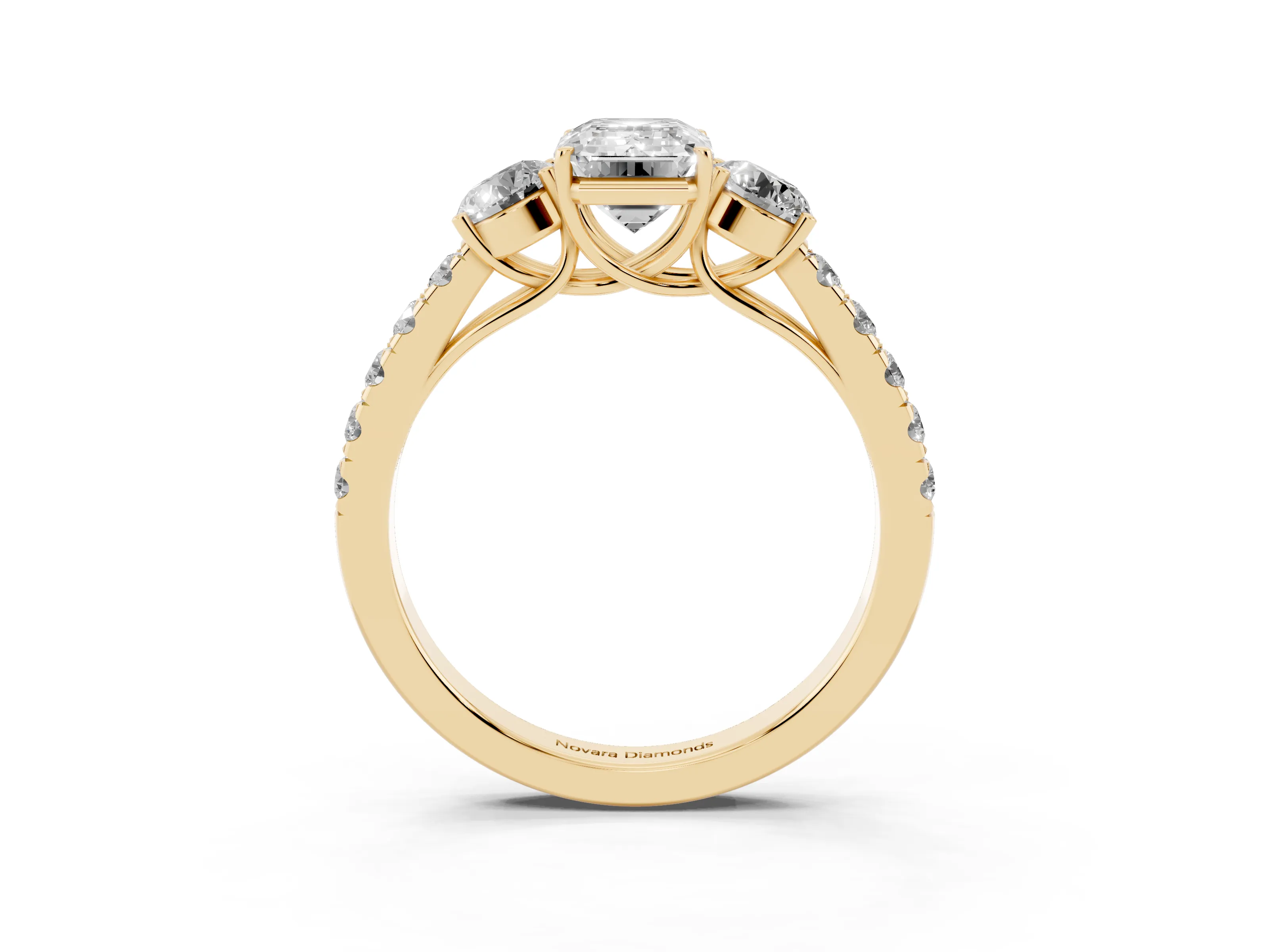 Emerald Cut Diamond Three-Stone Ring Set in Yellow gold with Round Side Stones and Delicate Pavé Band