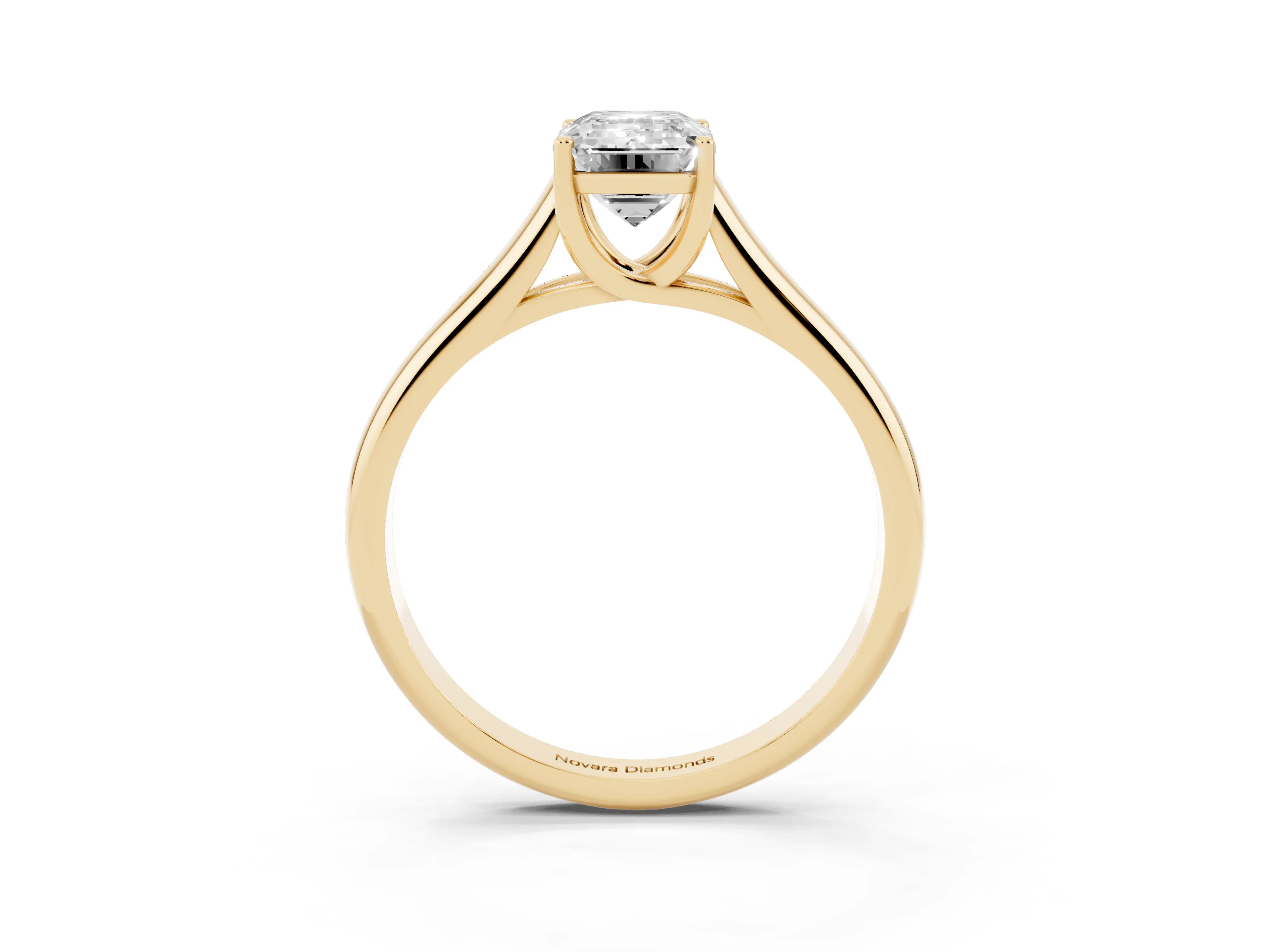 Emerald Cut Diamond Solitaire Engagement Ring Set in Yellow gold with Subtly Tapered Band and Prong Setting