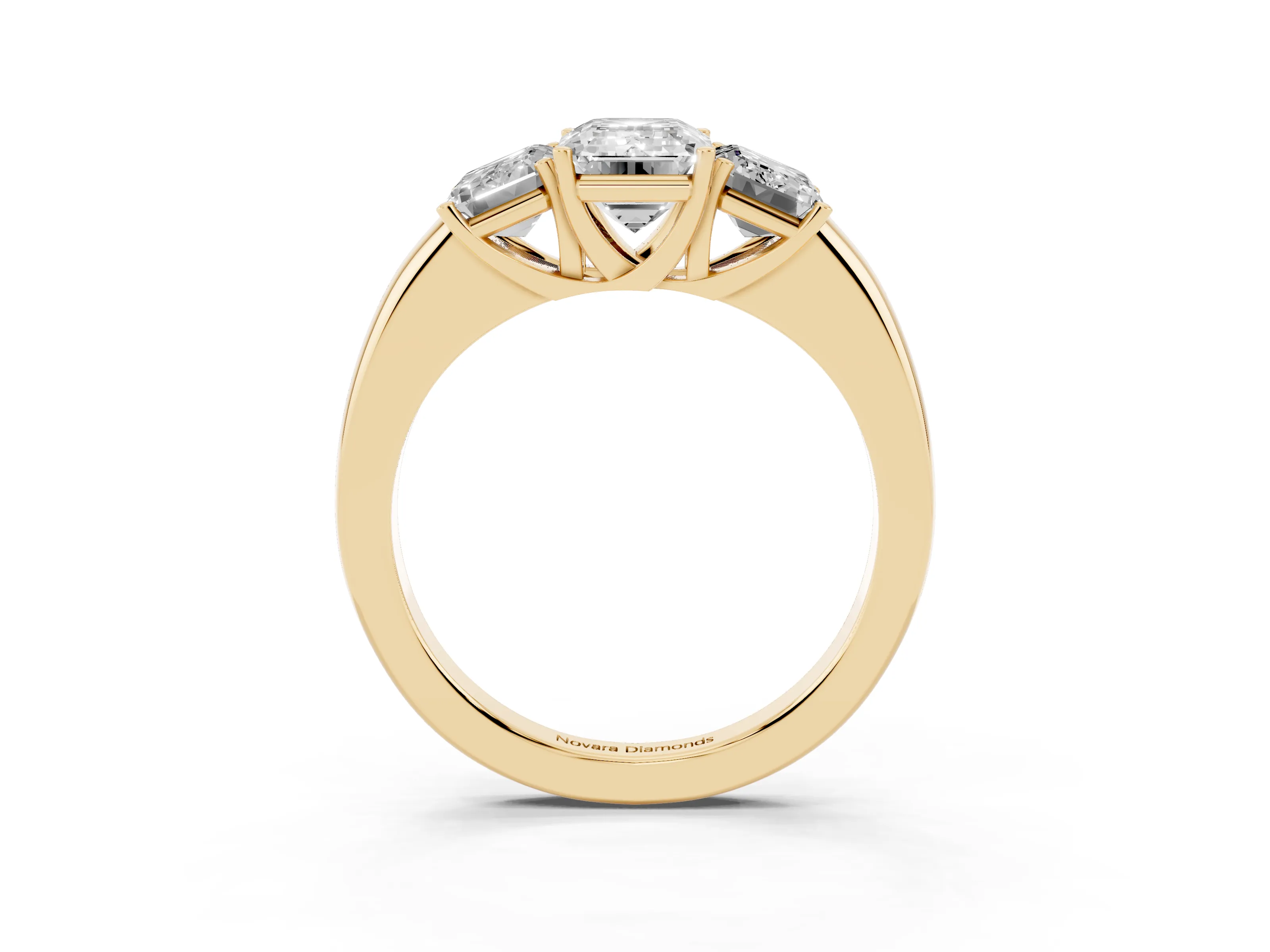 Emerald Cut Diamond Three-Stone Ring Set in Yellow gold with Bold Center and Classic Band