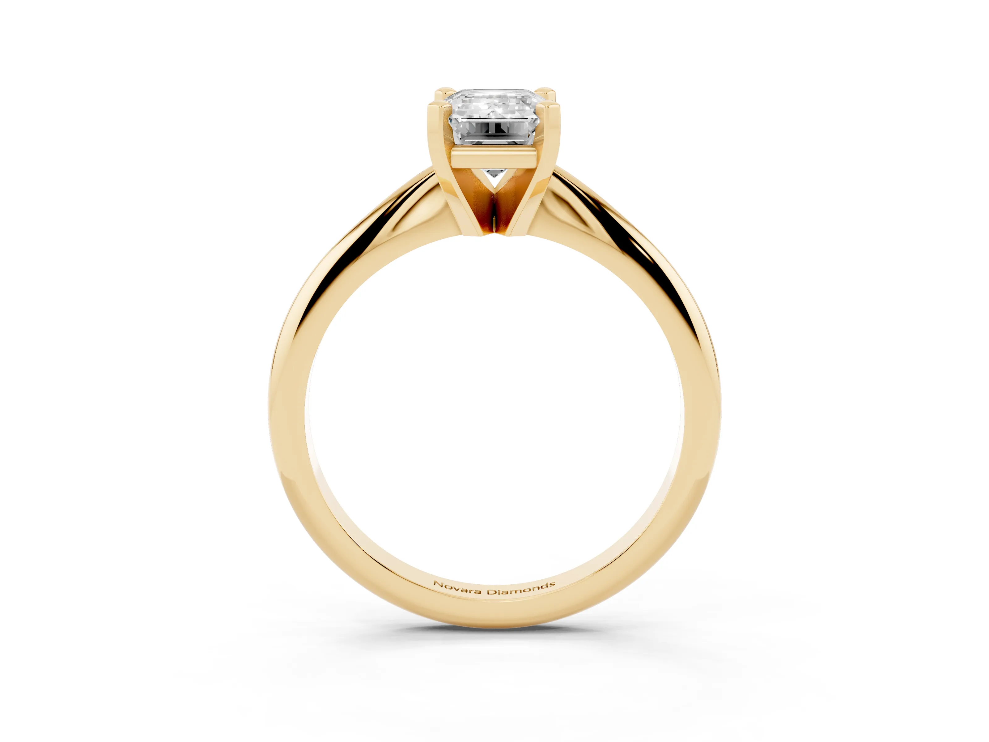 Emerald Cut Diamond Solitaire Ring Set in Yellow gold with Prong Setting on a Plain Round Band
