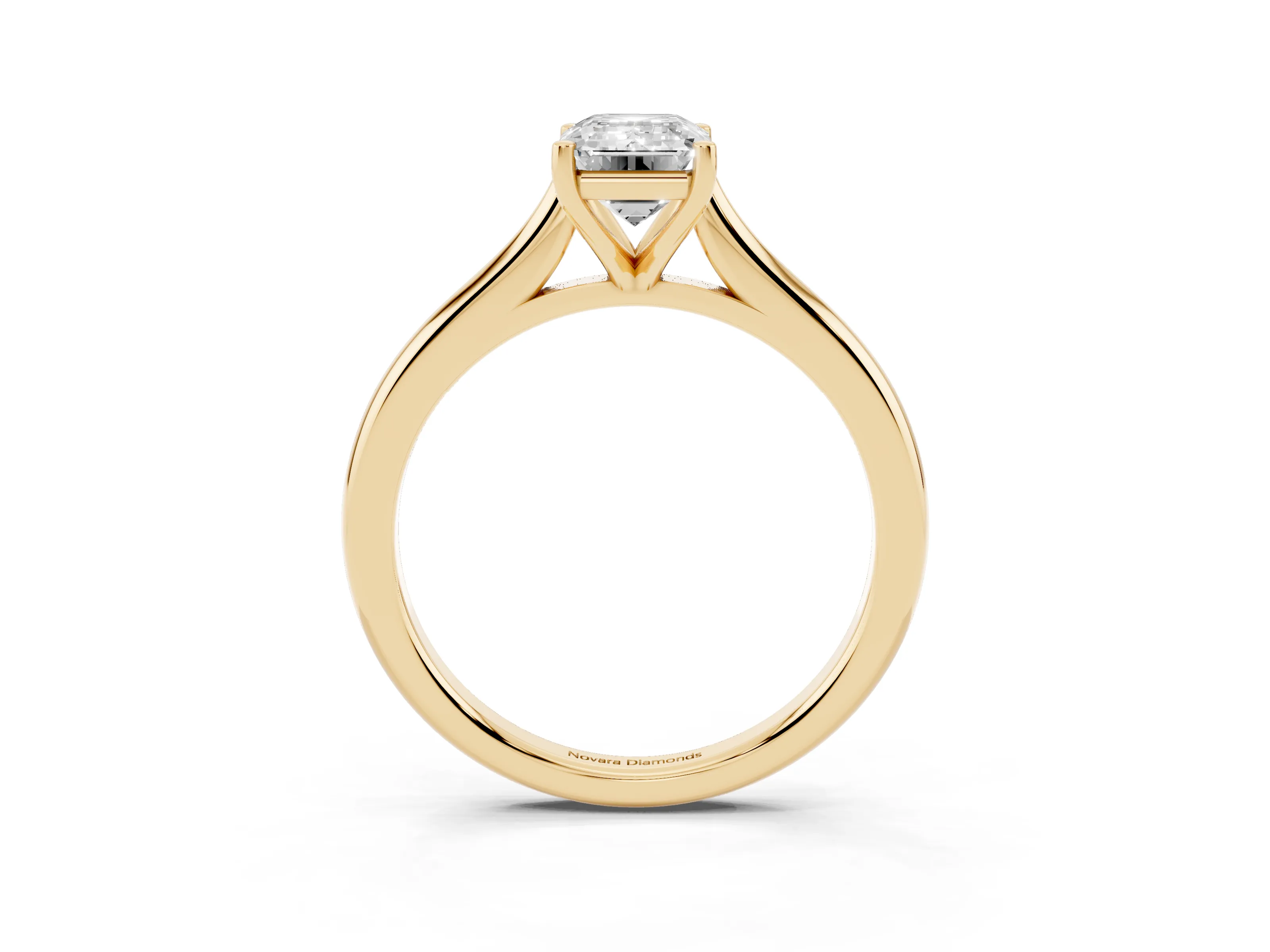 Emerald Cut Diamond Solitaire Ring Set in Yellow gold with Cathedral Band and Prong Setting