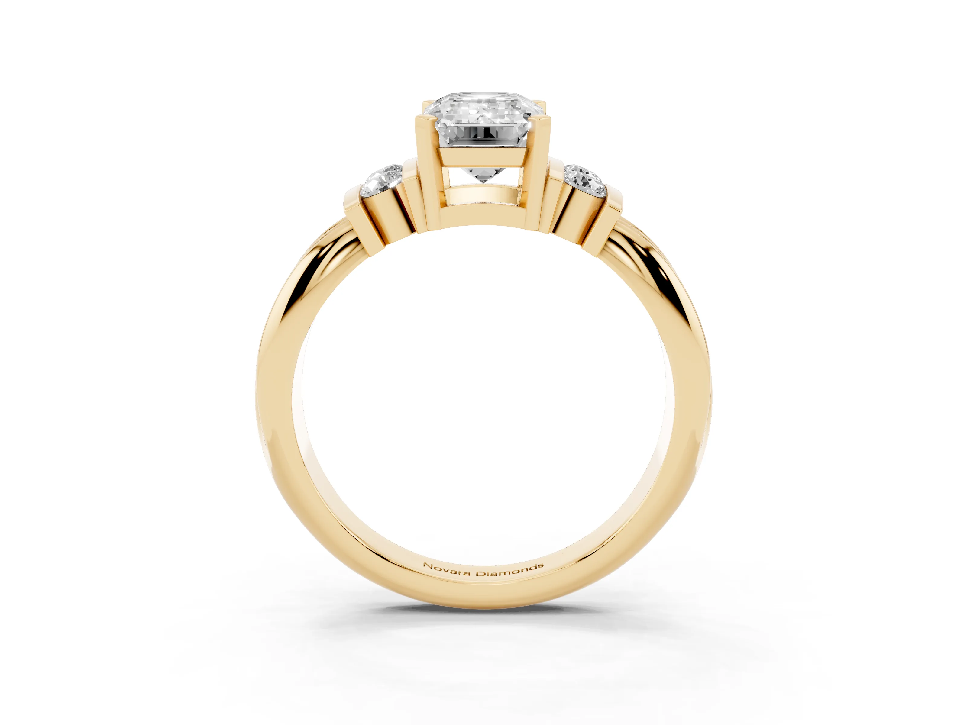 Three-Stone Emerald Cut Diamond Channel Set Ring Set in Yellow gold with Bar Prongs
