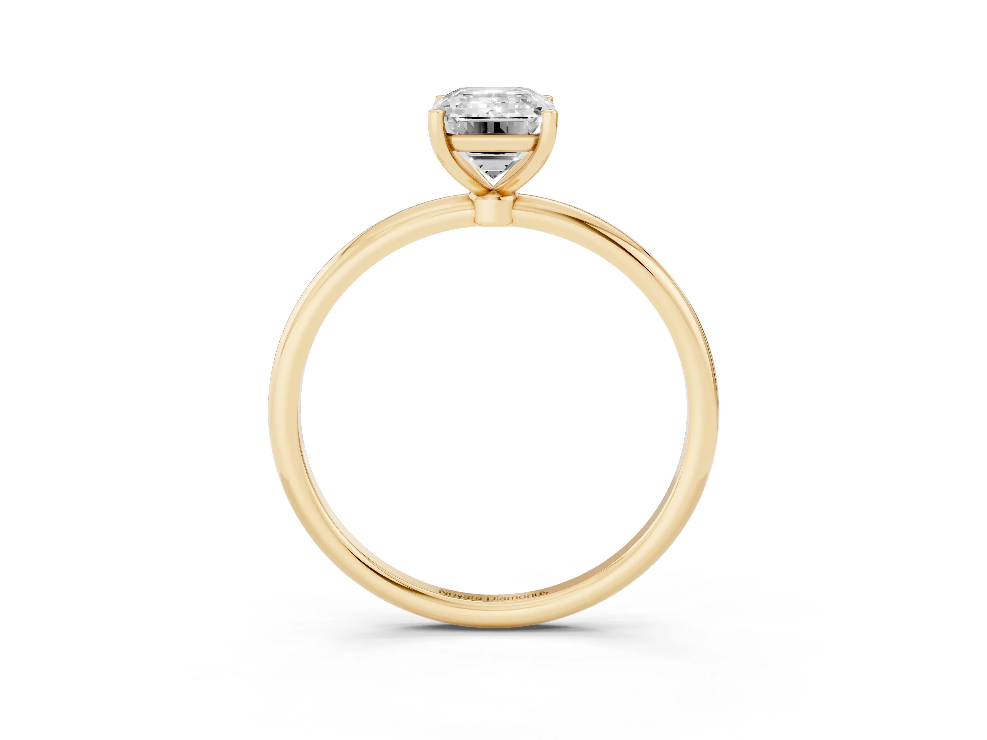 Emerald Cut Diamond Solitaire Engagement Ring Set in Yellow gold with Thin Band and Prong Setting