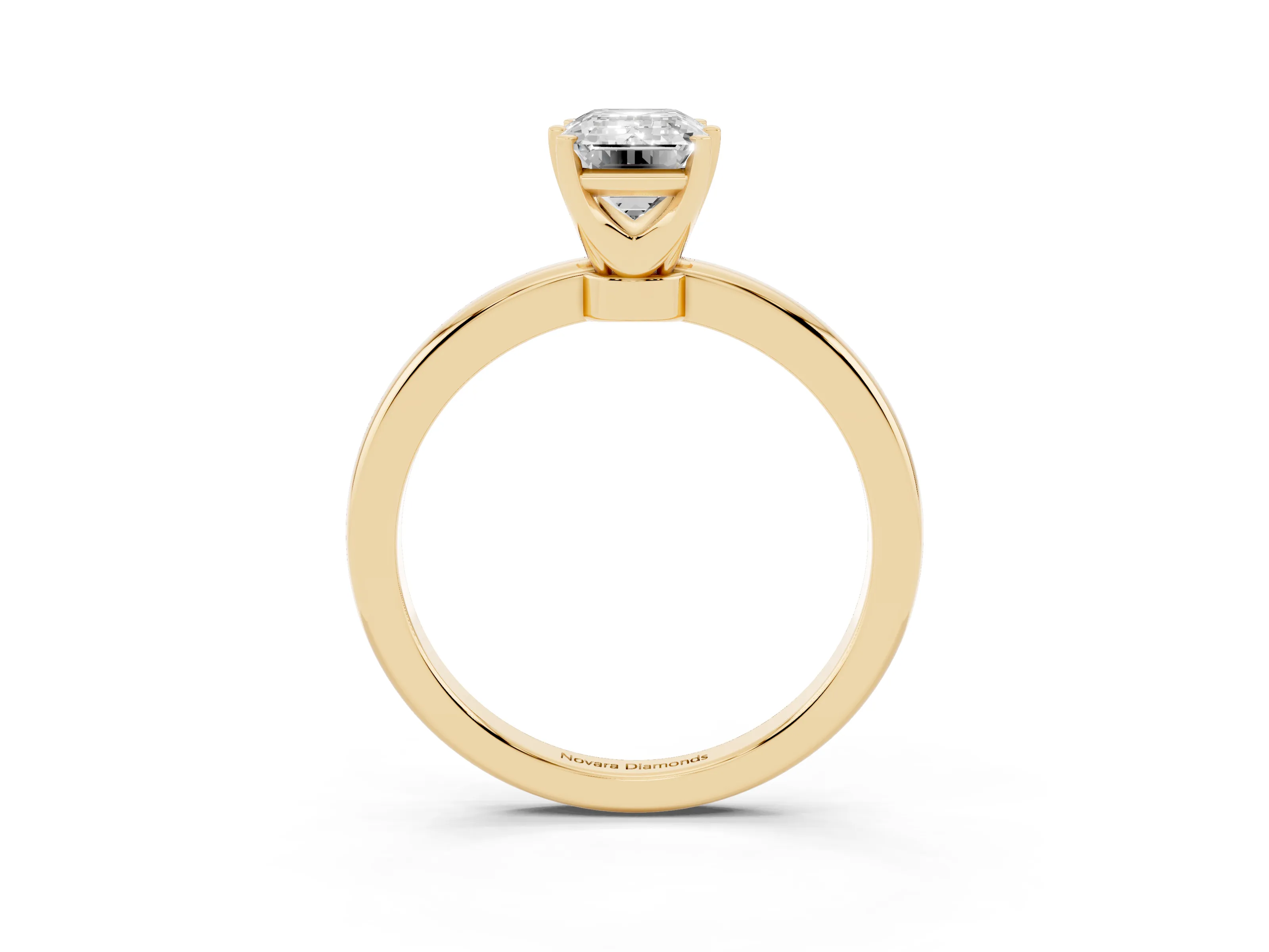 Emerald Cut Diamond Solitaire Ring Set in Yellow gold with Raised Prong Setting on a Classic Band