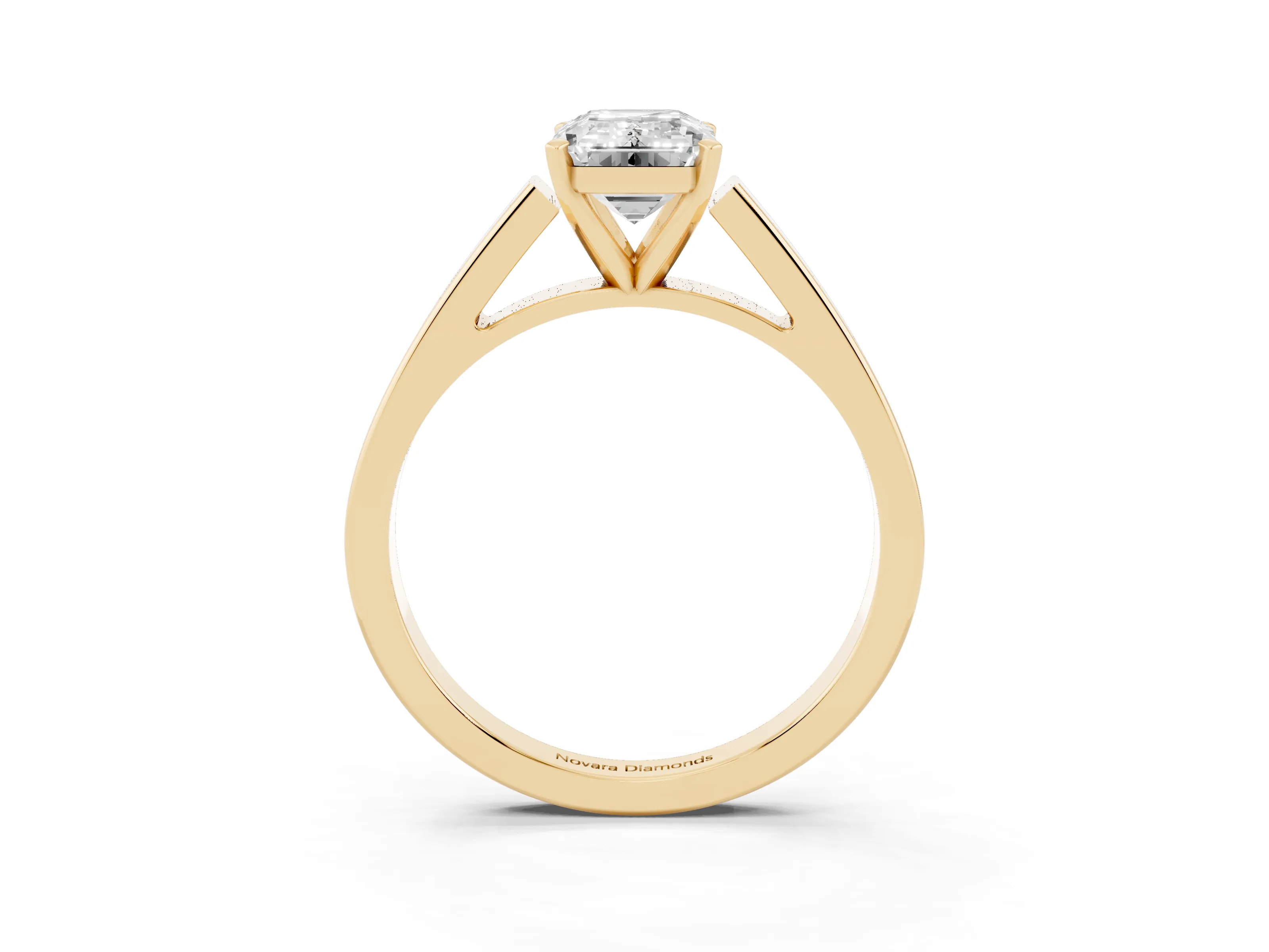 Emerald Cut Diamond Solitaire Engagement Ring Set in Yellow gold with Prong Setting and Tapered Band