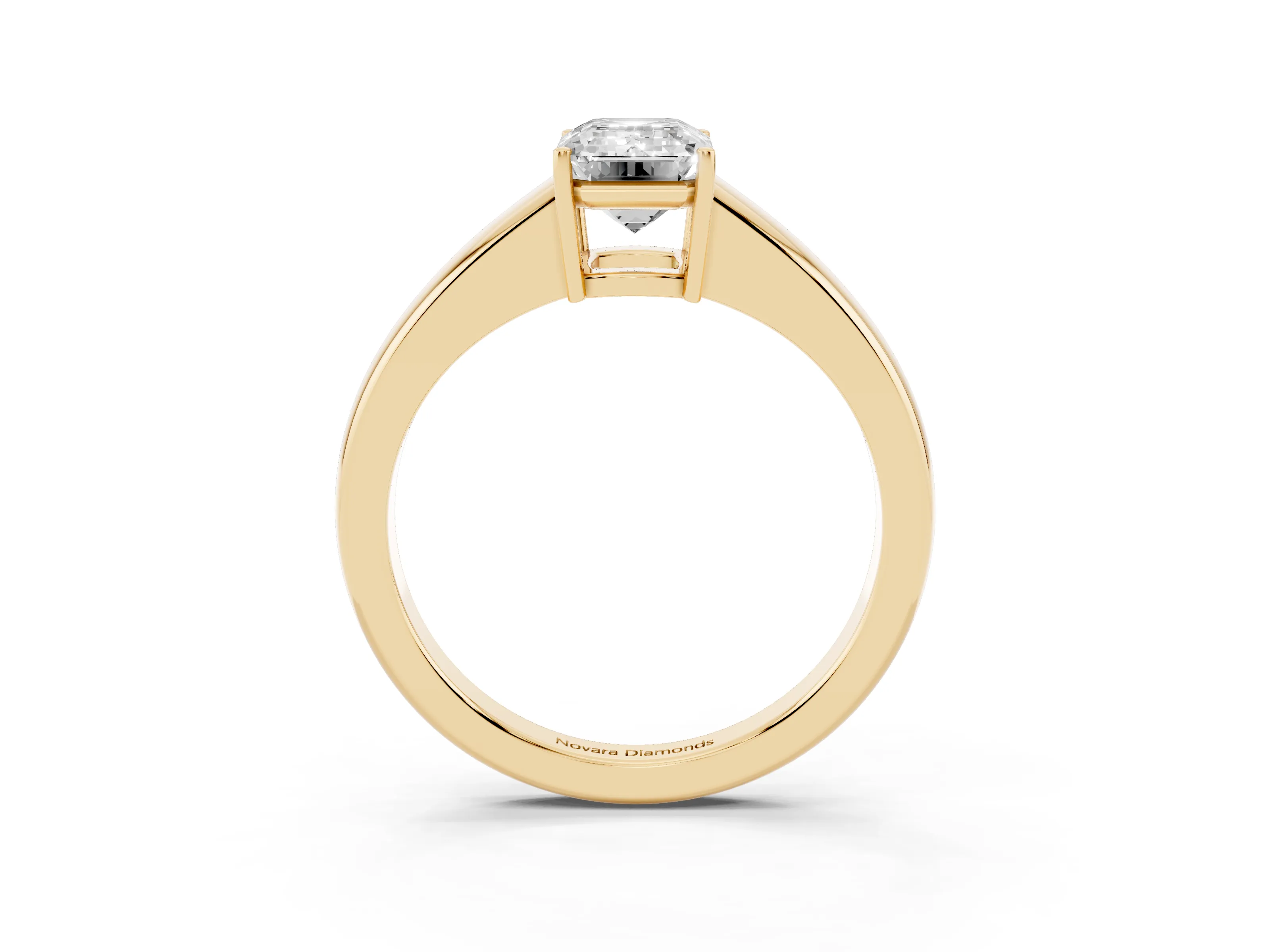 Emerald Cut Diamond Solitaire Ring Set in Yellow gold with Tapered Band and Prong Setting