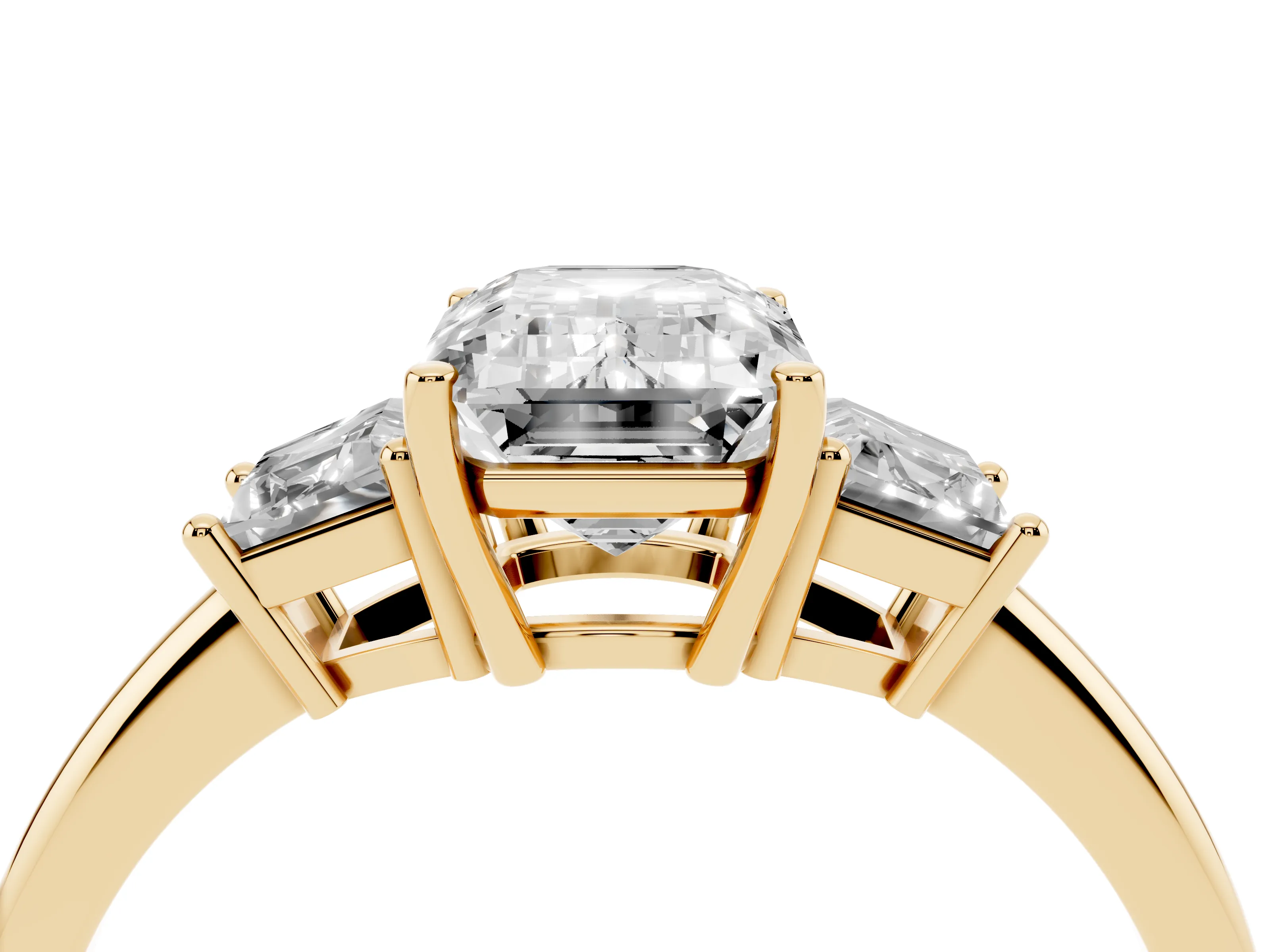 Emerald Cut Diamond Three-Stone Ring Set in Yellow gold with Trapezoid Side Stones and Prong Setting