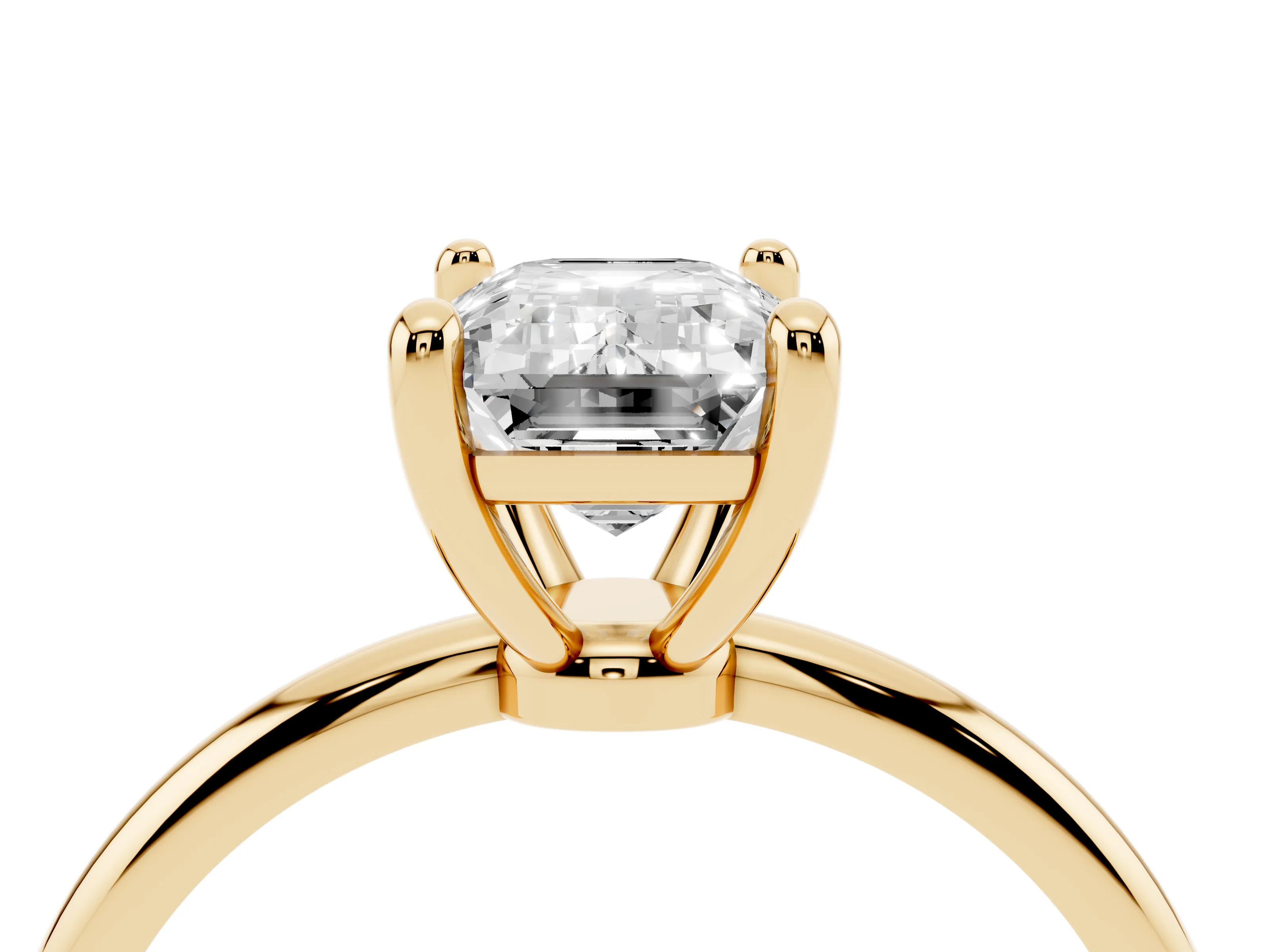 Emerald Cut Diamond Solitaire Ring Set in Yellow gold with Secure Prong Setting on a Classic Band