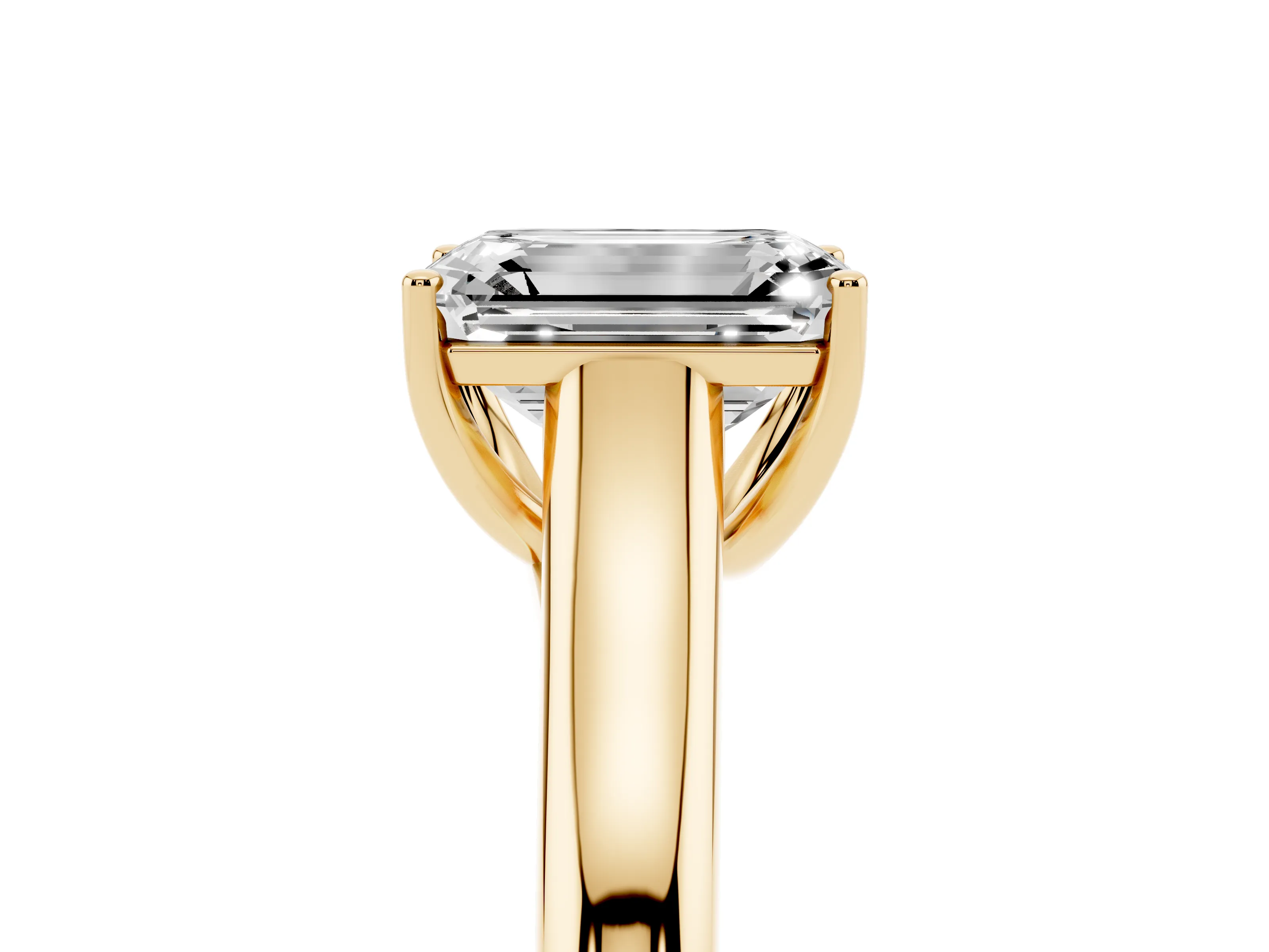 Emerald Cut Diamond Solitaire Engagement Ring Set in Yellow gold with Subtly Tapered Band and Prong Setting