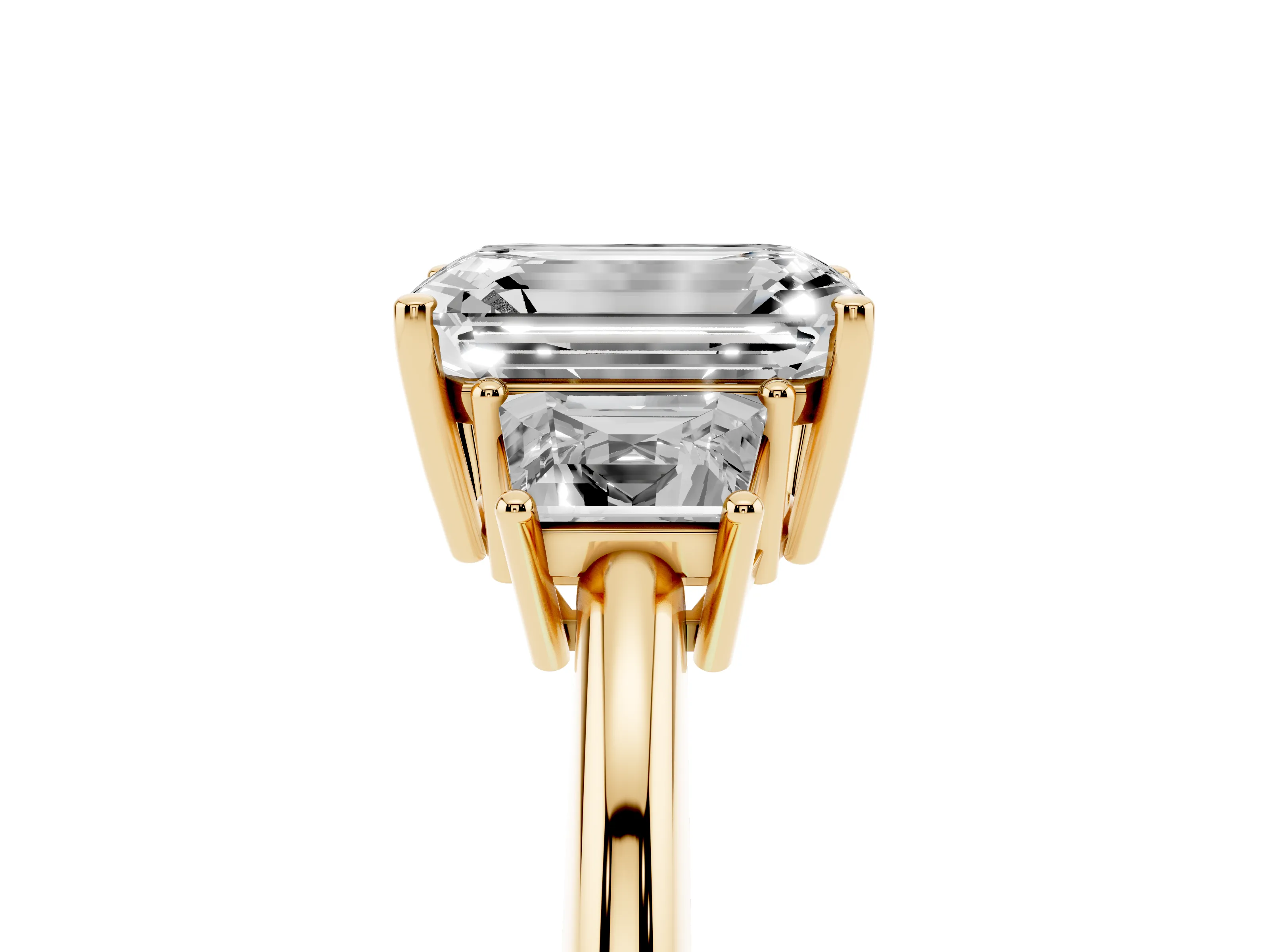 Emerald Cut Diamond Three-Stone Ring Set in Yellow gold with Trapezoid Side Stones and Prong Setting