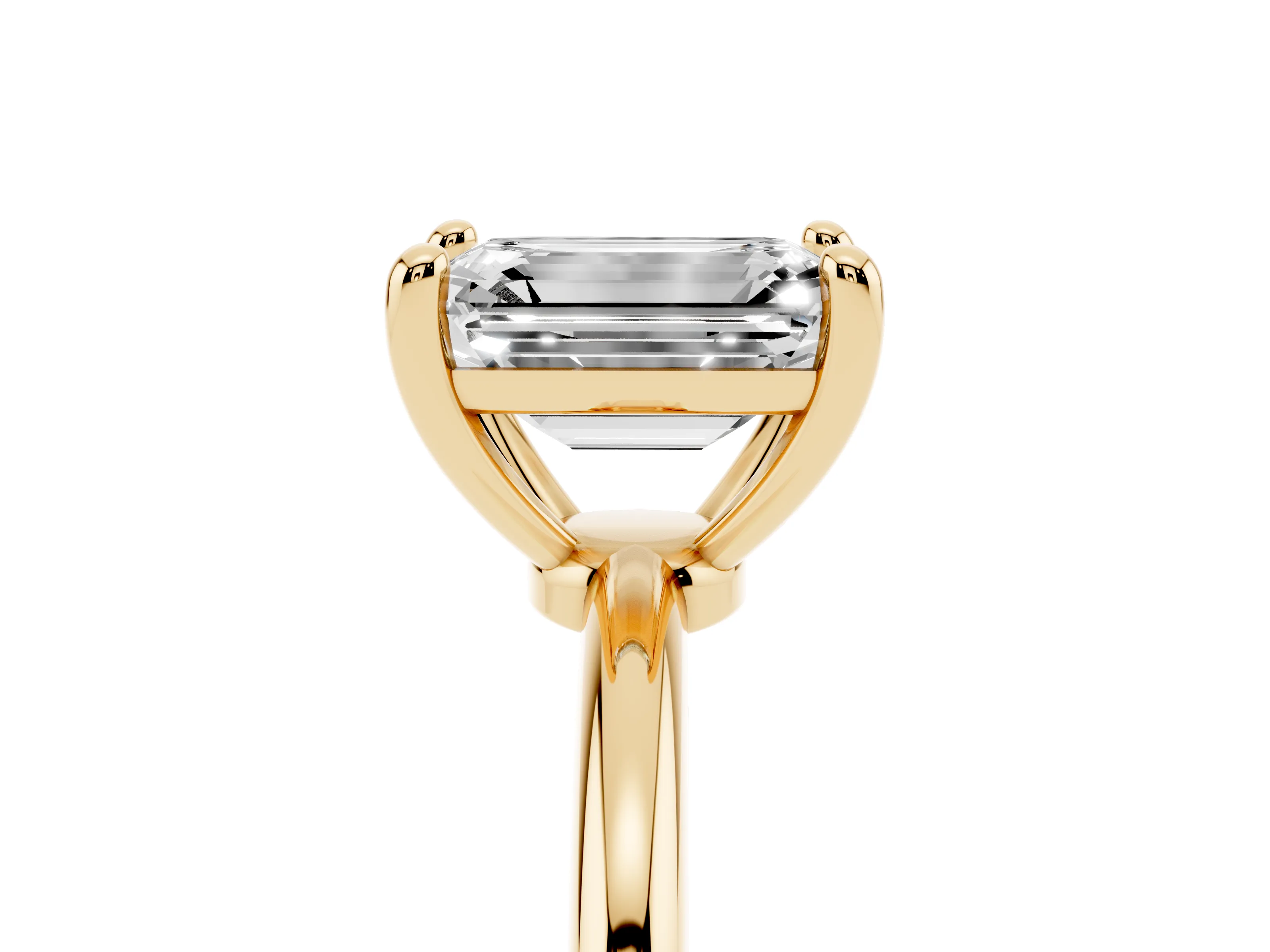 Emerald Cut Diamond Solitaire Ring Set in Yellow gold with Secure Prong Setting on a Classic Band