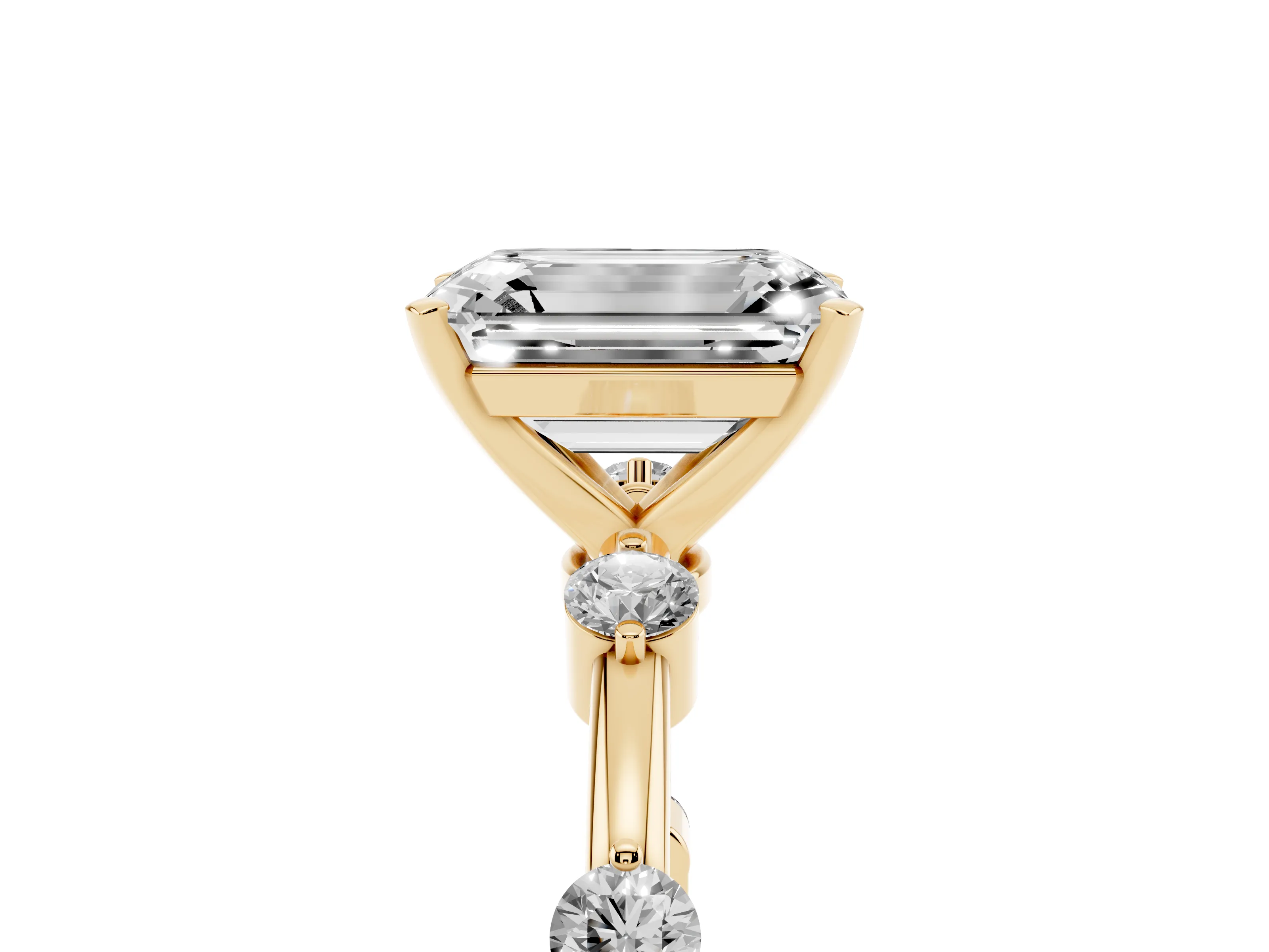 Emerald Cut Diamond Solitaire Ring Set in Yellow gold with Bezel Set Side Stones and Prong Setting