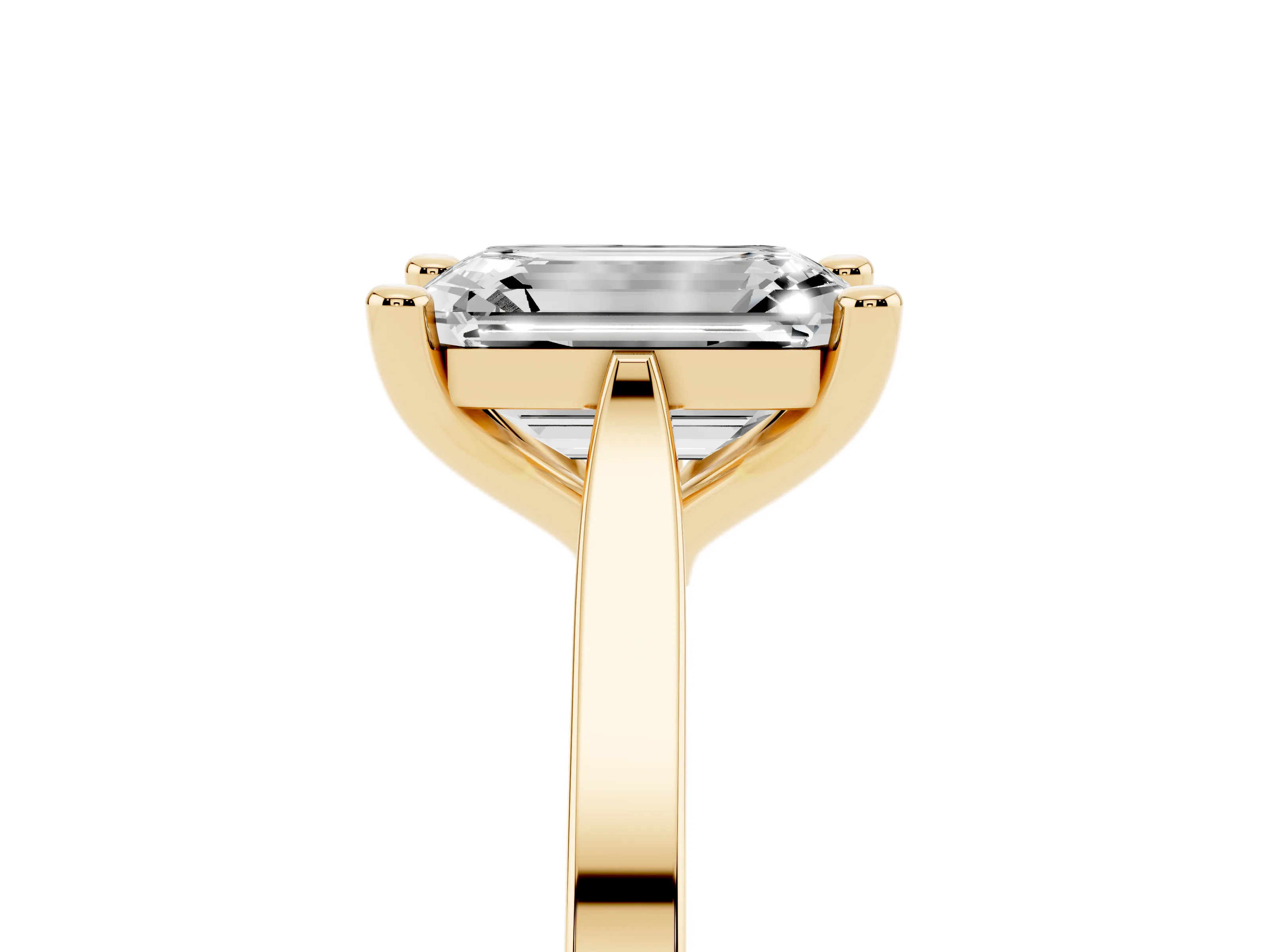 Emerald Cut Diamond Solitaire Ring Set in Yellow gold with Prong Setting and Tapered Band