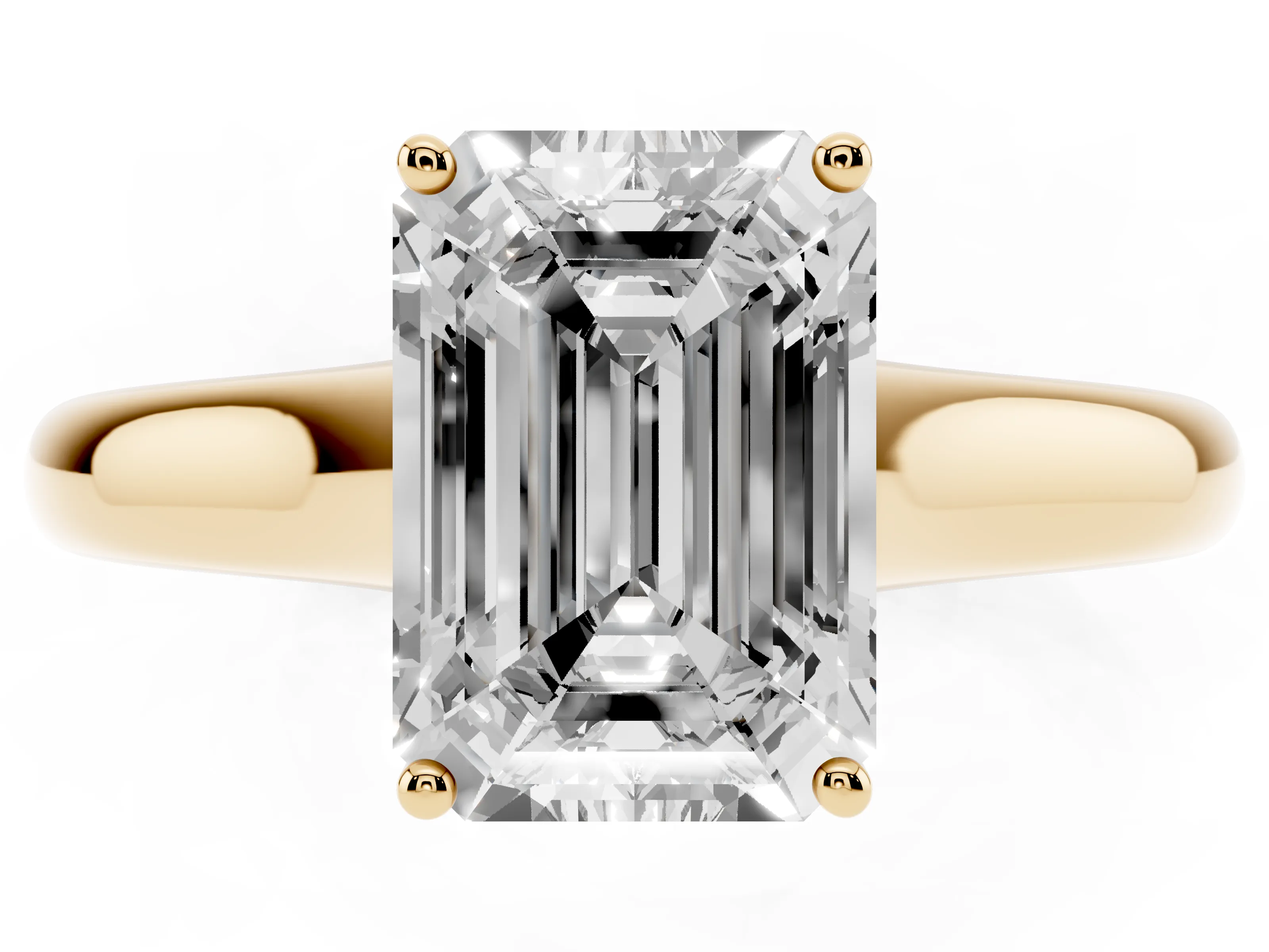Emerald Cut Diamond Solitaire Engagement Ring Set in Yellow gold with Subtly Tapered Band and Prong Setting