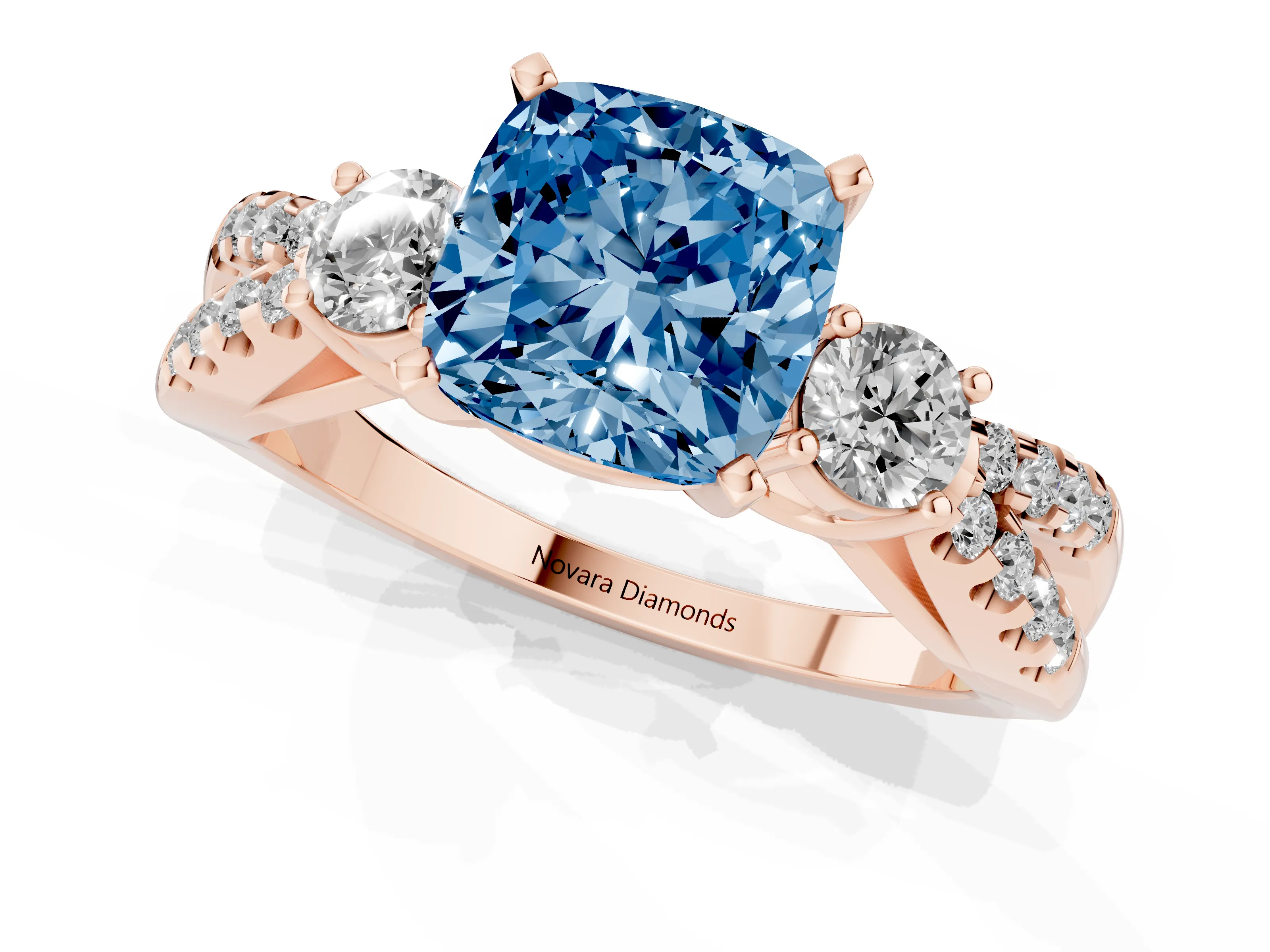Fancy Blue Cushion Cut Diamond Three-Stone Ring Set in Rose gold with Pavé Split Shank and Prong Setting