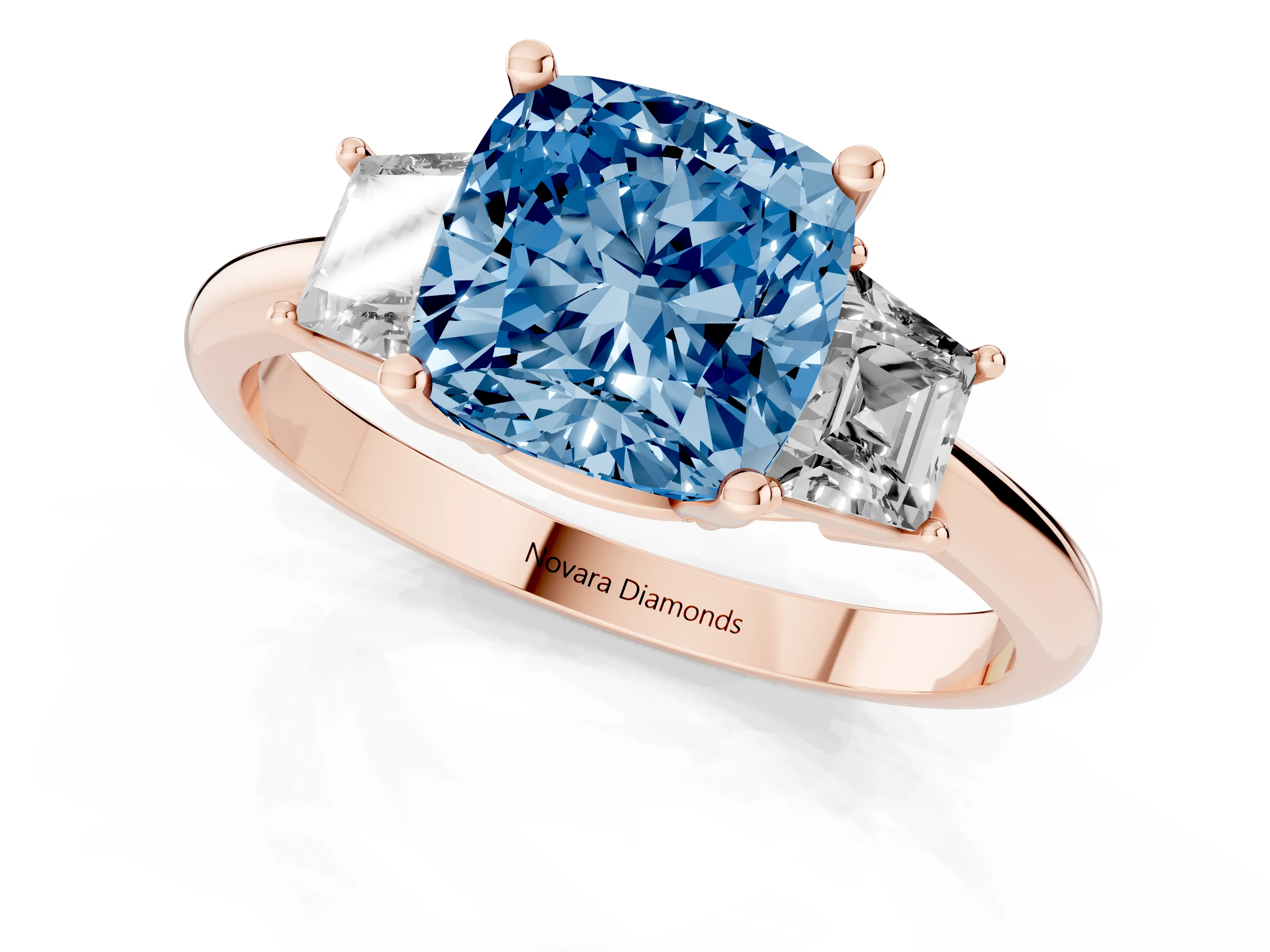 Fancy Blue Cushion Cut Diamond Three-Stone Ring Set in Rose gold with Trapezoid Side Stones and Prong Setting