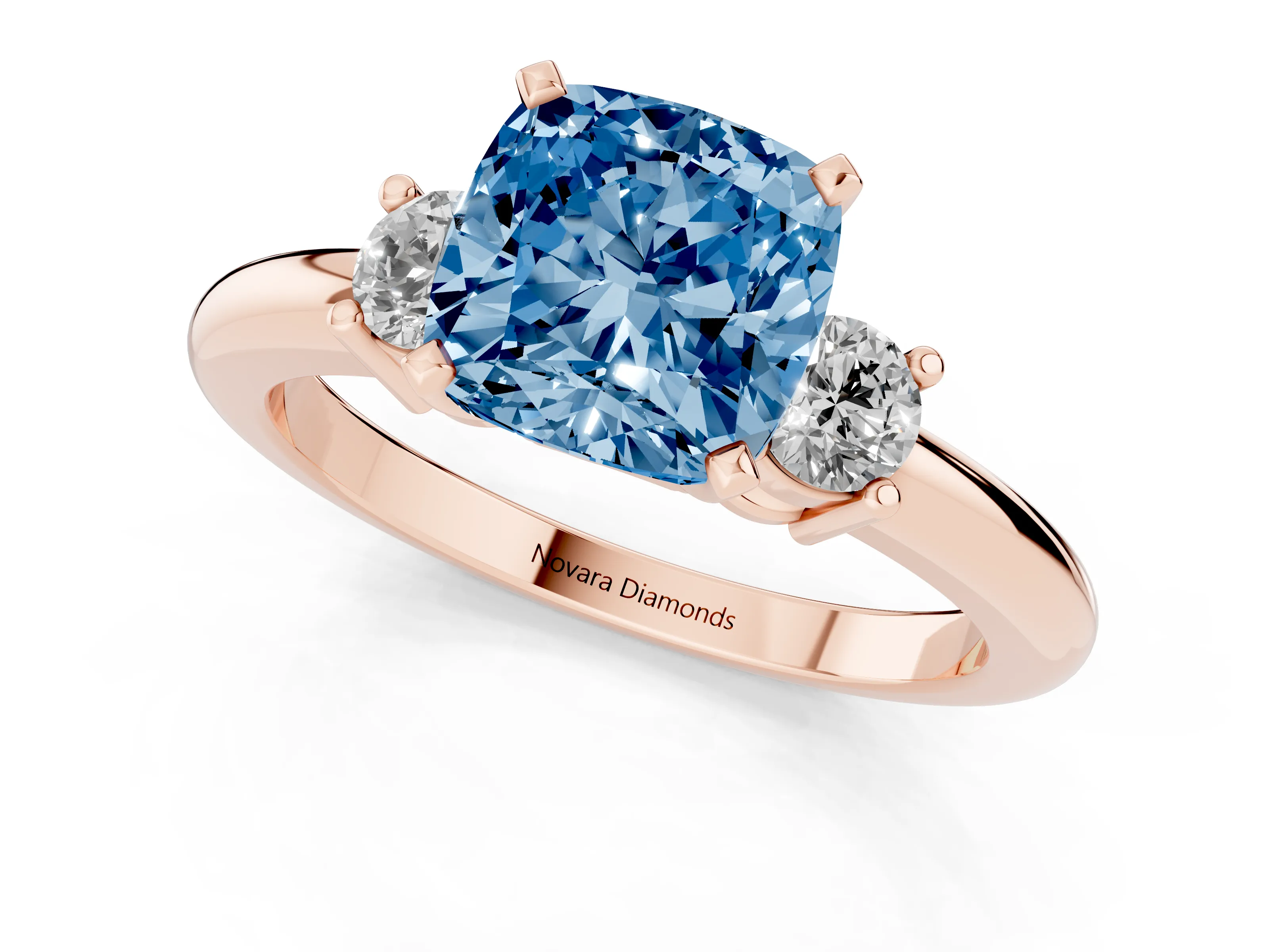 Fancy Blue Three-Stone Cushion Cut Diamond Ring Set in Rose gold with Prong Setting and Plain Band
