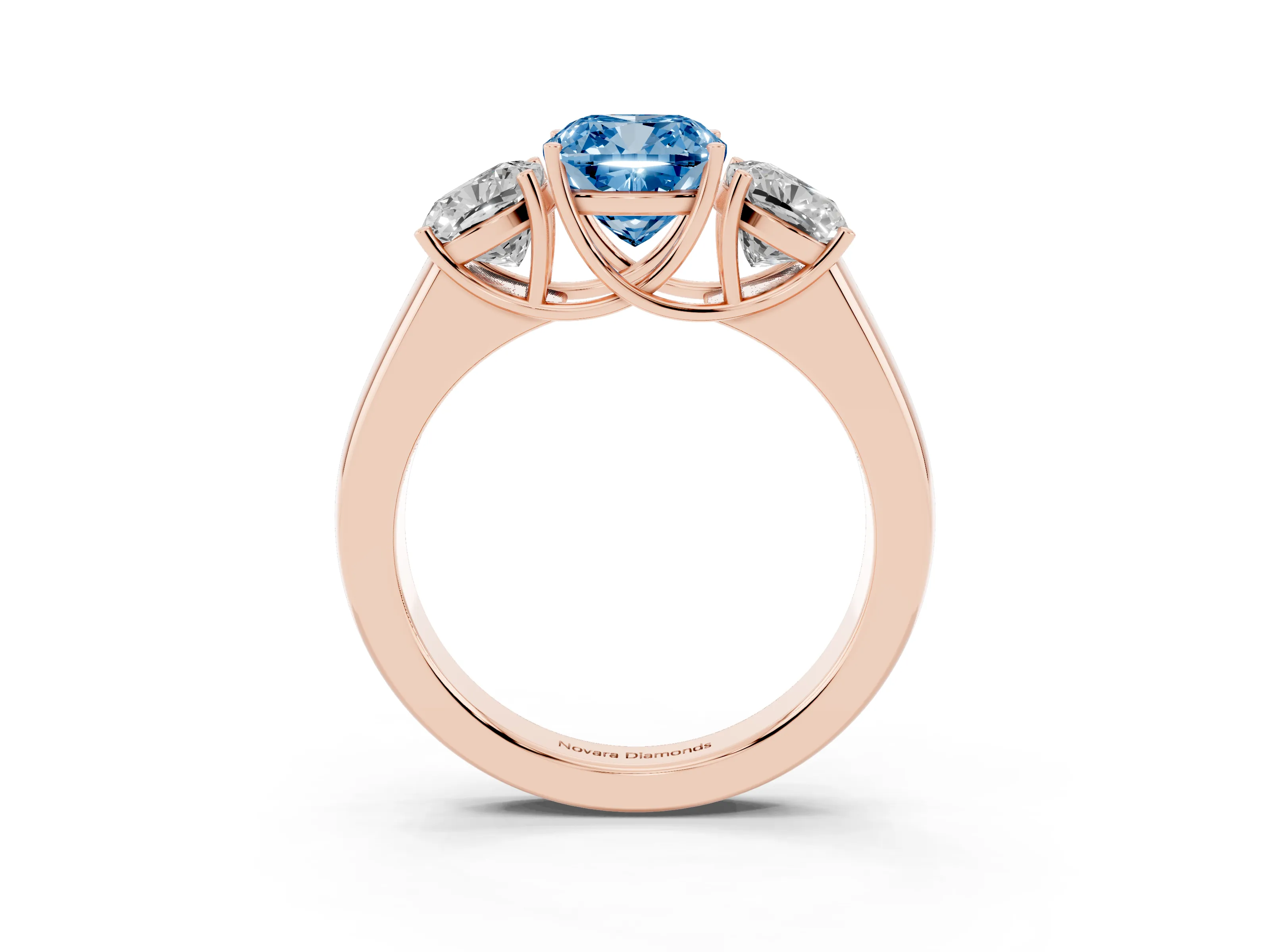 Fancy Blue Three-Stone Cushion Cut Diamond Ring Set in Rose gold with Matching Prong Settings and Plain Band