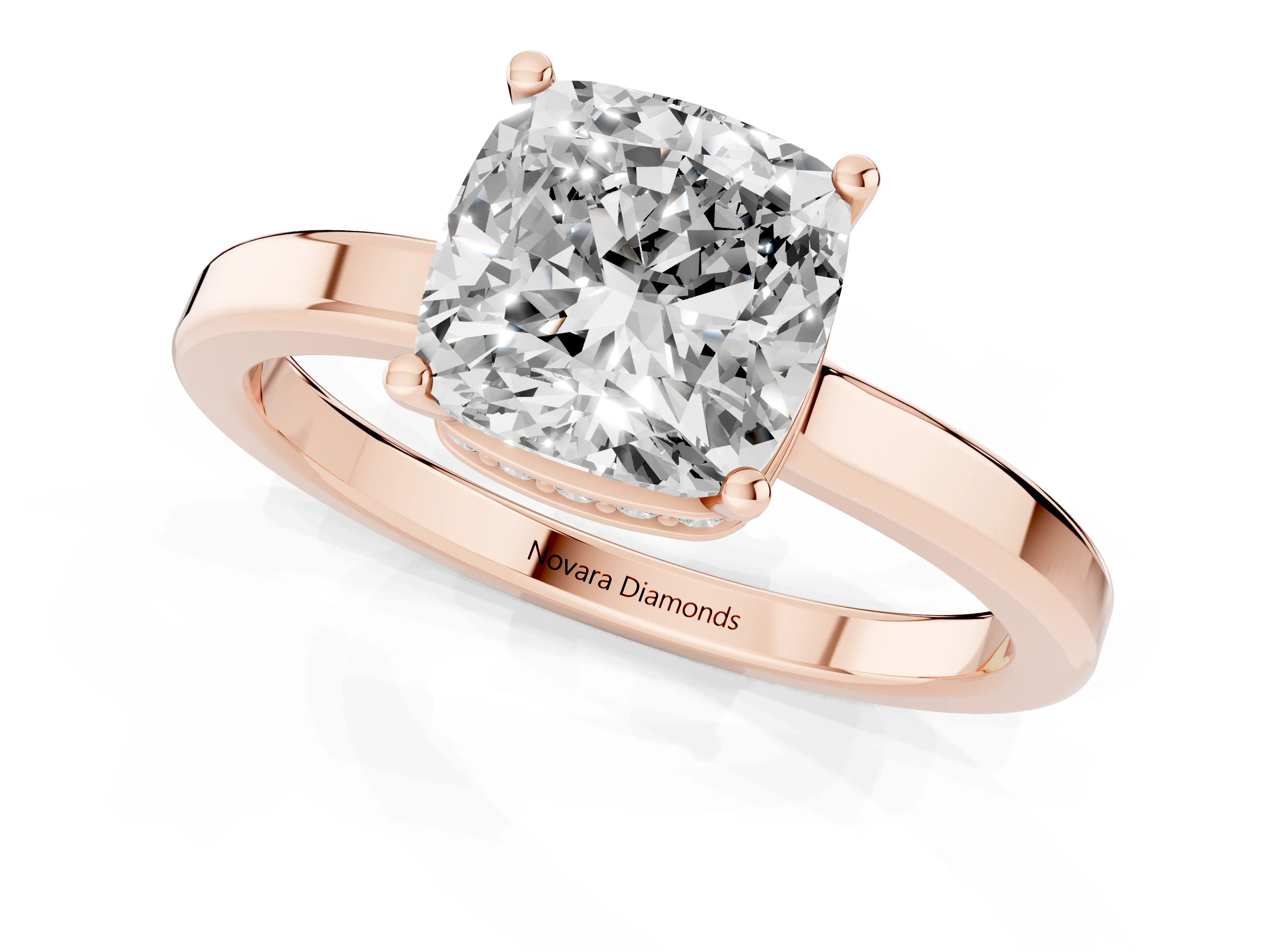 Cushion Cut Diamond Solitaire Engagement Ring Set in Rose gold with Prong Setting on a Plain Band