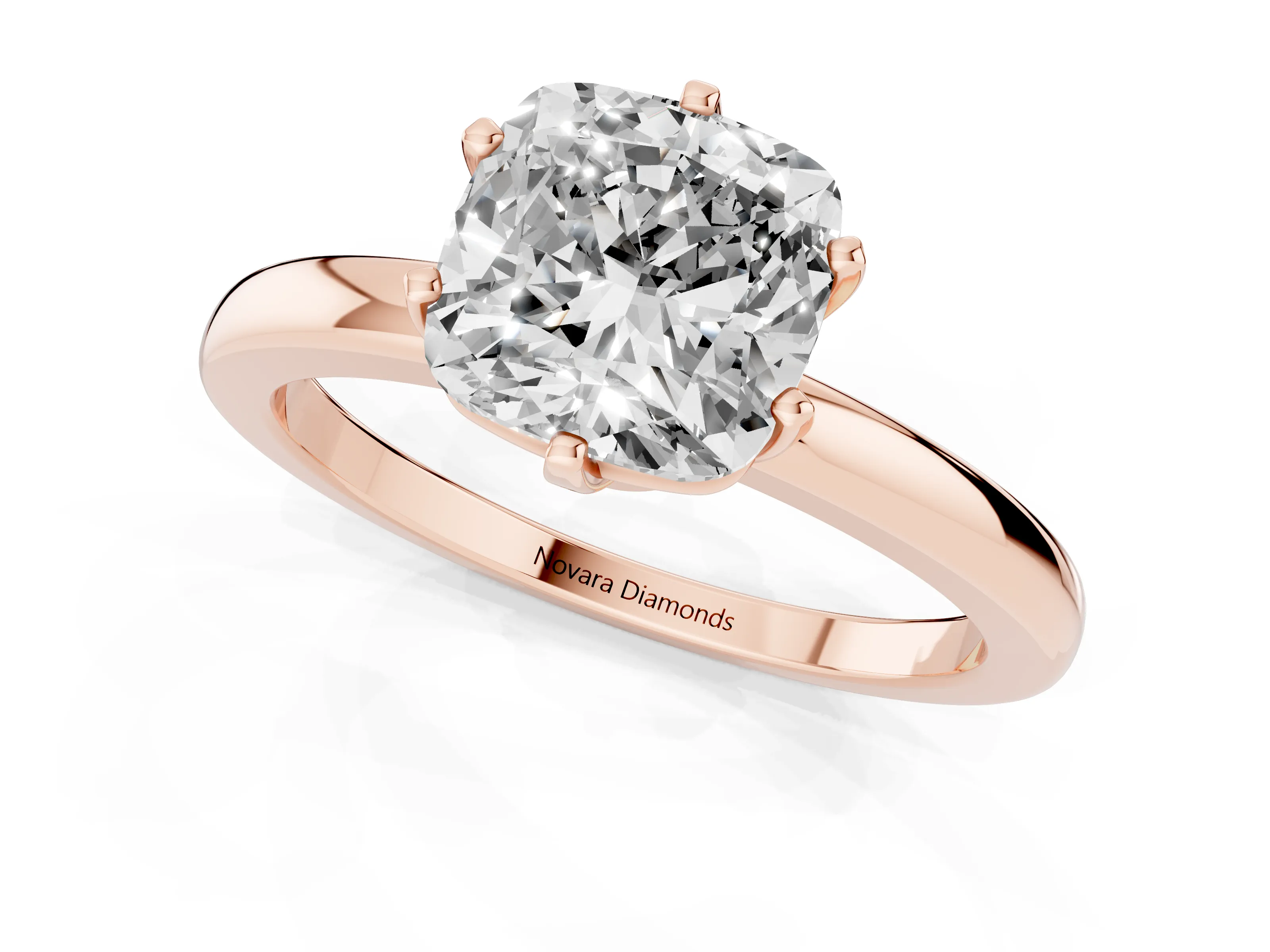 Cushion Cut Diamond Solitaire Ring Set in Rose gold with Raised Prong Setting on a Classic Band